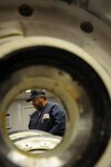 Lou Chatman inspects a T-38 wheel prior to assembly at the Aircraft Wheel and Tire Shop on Feb. 18. The new $53,000 facility features upgrades like separate work and break areas, a fire-suppression system, better lighting and a much-improved temperature and humidity control. (U.S. Air Force photo by Steve White)