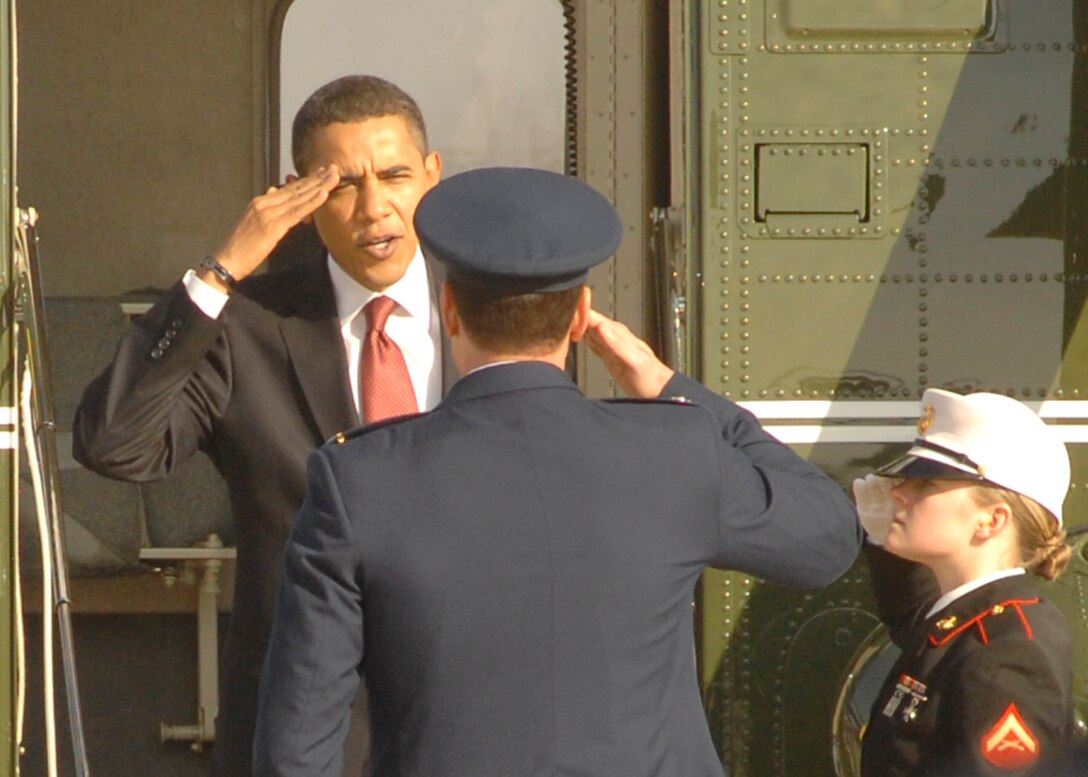 President Barack H. Obama returns a salute to Col. Steven M. Shepro, 316th Wing commander, while stepping out of Marine One prior to his flight to Elkhart, In., Feb. 9. (U.S. Air Force photo by Airman 1st Class Melissa Rodrigues)