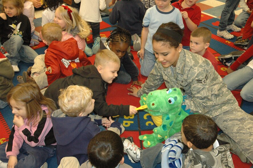 Airman First Class Laura Lopez-Gardea, 325th Aeromedical-Dental Squadron dental assistant, shows Tyndall Elementary School Pre-K and Kindergarten students the proper way to brush teeth Monday.  February is National Children’s Dental Health Month and 325th AMDS personnel will be visiting Tyndall Elementary every day this week to promote dental awareness and promote the benefits of good oral health to the children.  (U.S. Air Force photo by Senior Airman Anthony J. Hyatt)