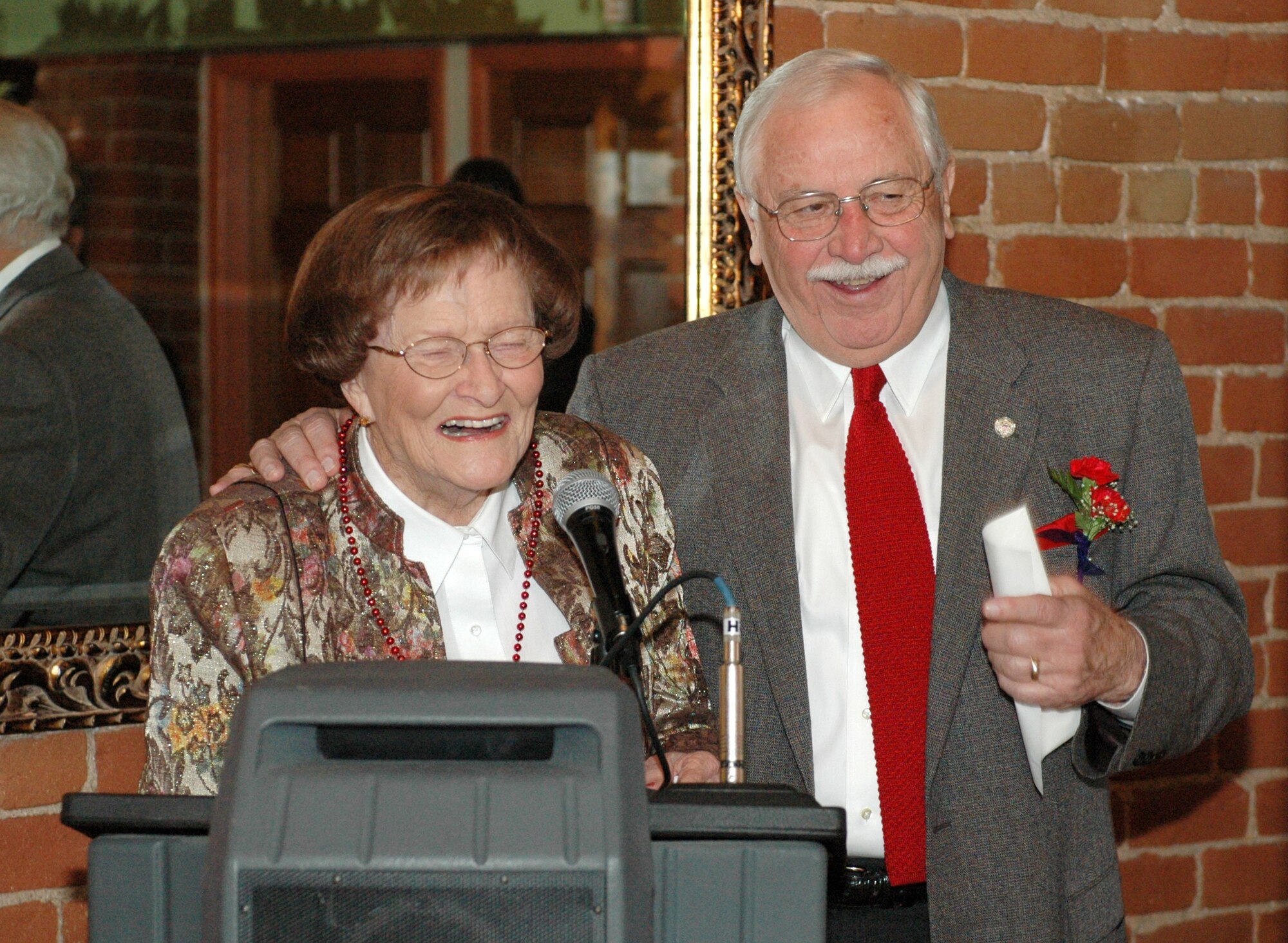 Tucson business and community icons Bill Valenzuela and Dorothy Finley trade jokes from the podium at the Tucson Light award banquet, Feb 13. Finley was one of Valenzuela’s grade school teachers. (Air National Guard photo by Capt. Gabe Johnson)