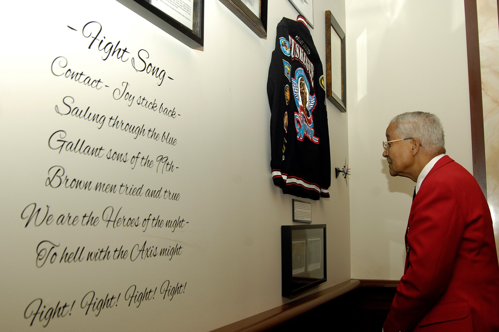 HANSCOM AIR FORCE BASE, Mass. – Col. Charles McGee, a decorated war hero and original Tuskegee Airman, looks at a display of memorabilia honoring the service, contributions of the Tuskegee Airmen at the Minuteman Club on Feb. 11. (U.S. Air Force photo by Linda LaBonte Britt)

