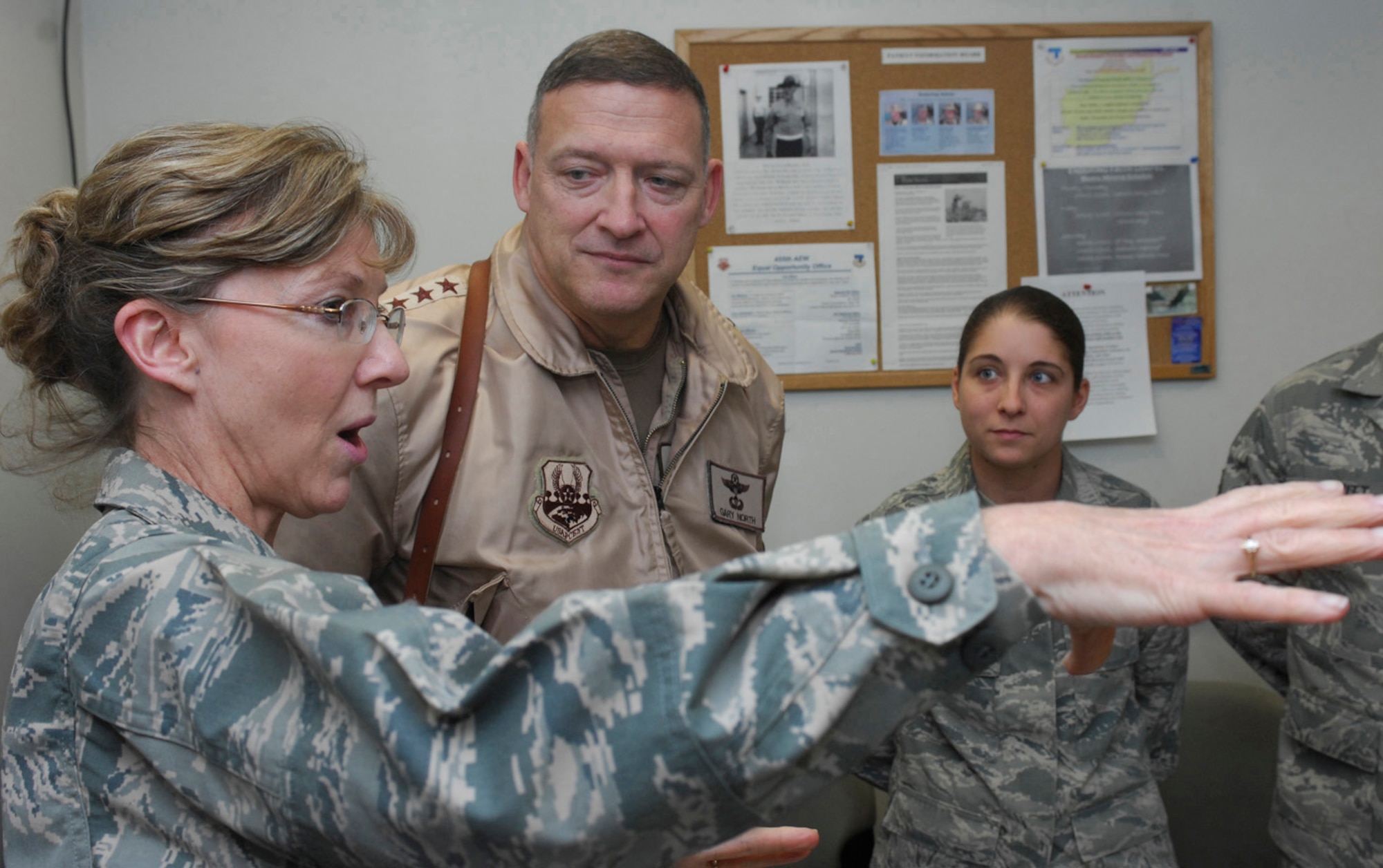Lt. Col.  Karen Smith, 455th Expeditionary Medical Group's combat stress control detachment commander, briefs Lt. Gen. Gary North, 9th Air Force and U.S. Air Forces Central commander, about the achievements of the combat stress flight at the Craig Joint-Theater Hospital at Bagram Air Field, Afghanistan, Feb. 17. The general traveled along with Chief Master Sgt. Scott Dearduff, 9th Air Force and U.S. Air Forces Central command chief master sergeant, and retired Lt. Gen. Eugene Santarelli, an Air Force senior mentor, to speak with hundreds of Bagram Airmen about some of the challenges they will face in the coming months and thank Airmen who are nearing the end of their deployment rotation for their contribution to Operation Enduring Freedom and the Global War on Terrorism. (U.S. Air Force photo by Staff Sgt. Jason Lake)