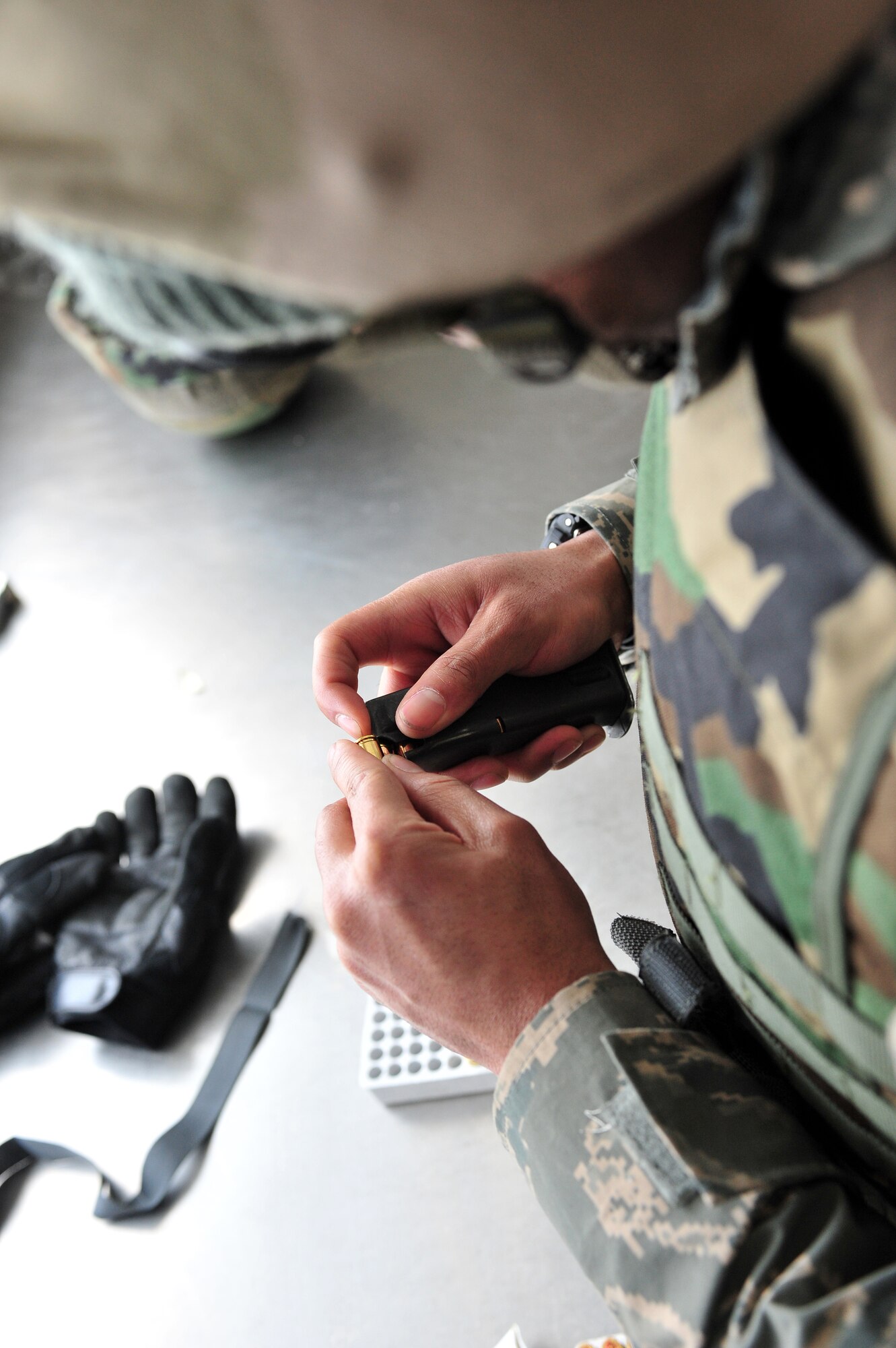 Master Sergeant Roy Pflughoeft, 354th Civil Engineering Squadron, loads an M-9 magazine Feb. 18, 2009 at the 354th Security Forces Squadron Combat Arms Training and Maintenance Facility on Eielson Air Force Base, Alaska. Airmen are required to qualify with the M-9 for a variety of reasons such as deployments and job requirements.(U.S. Air Force photo/ Airman 1st Class Willard E. Grande II)