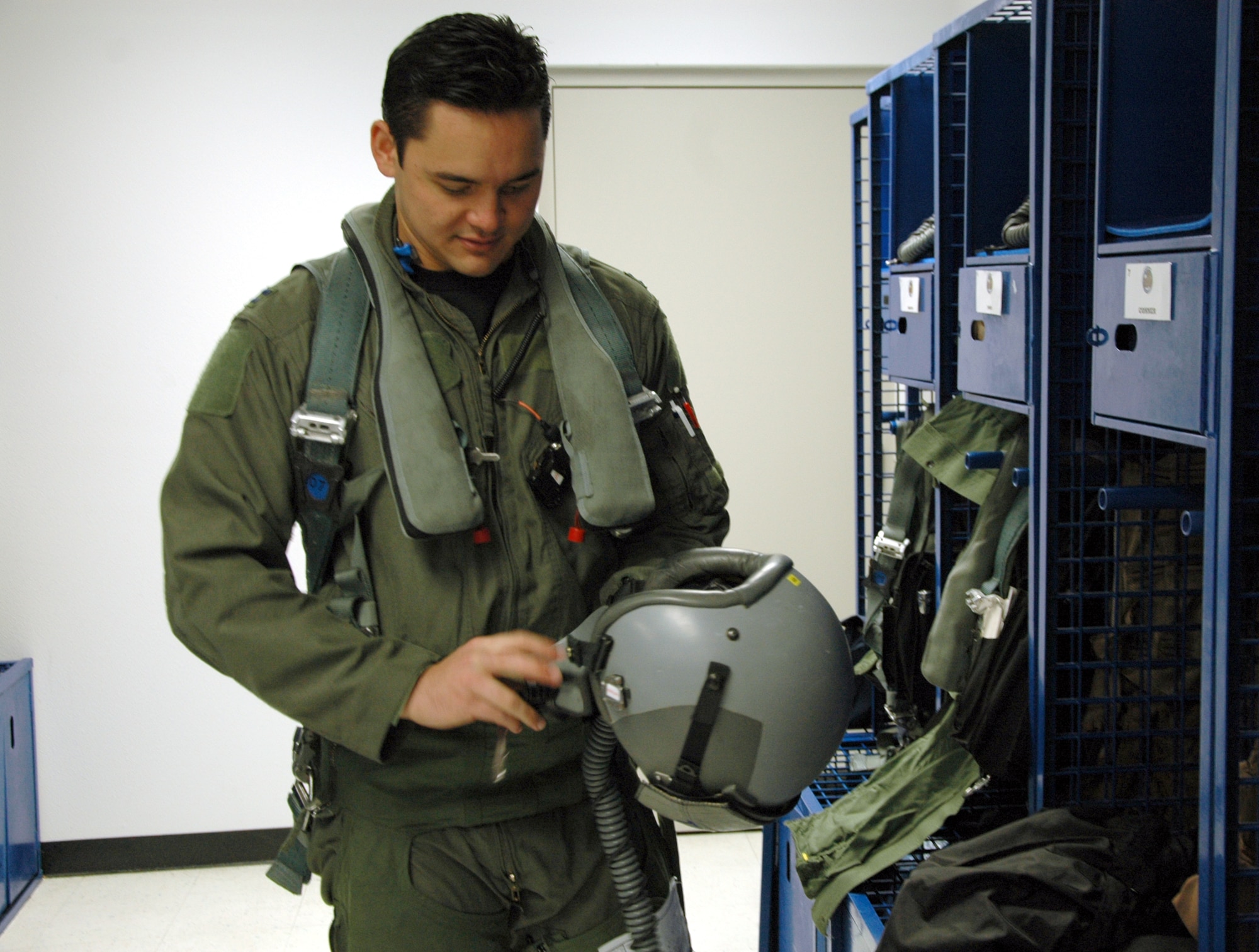 EGLIN AIR FORCE BASE, Fla. – Capt. Vaimana Conner, 58th Fighter Squadron electronic combat officer, puts on his flight gear. The 33rd Fighter Wing’s fighter pilots fly F-15C Eagles in air-to-air combat. (U.S. Air Force photo/Noel Getlin)