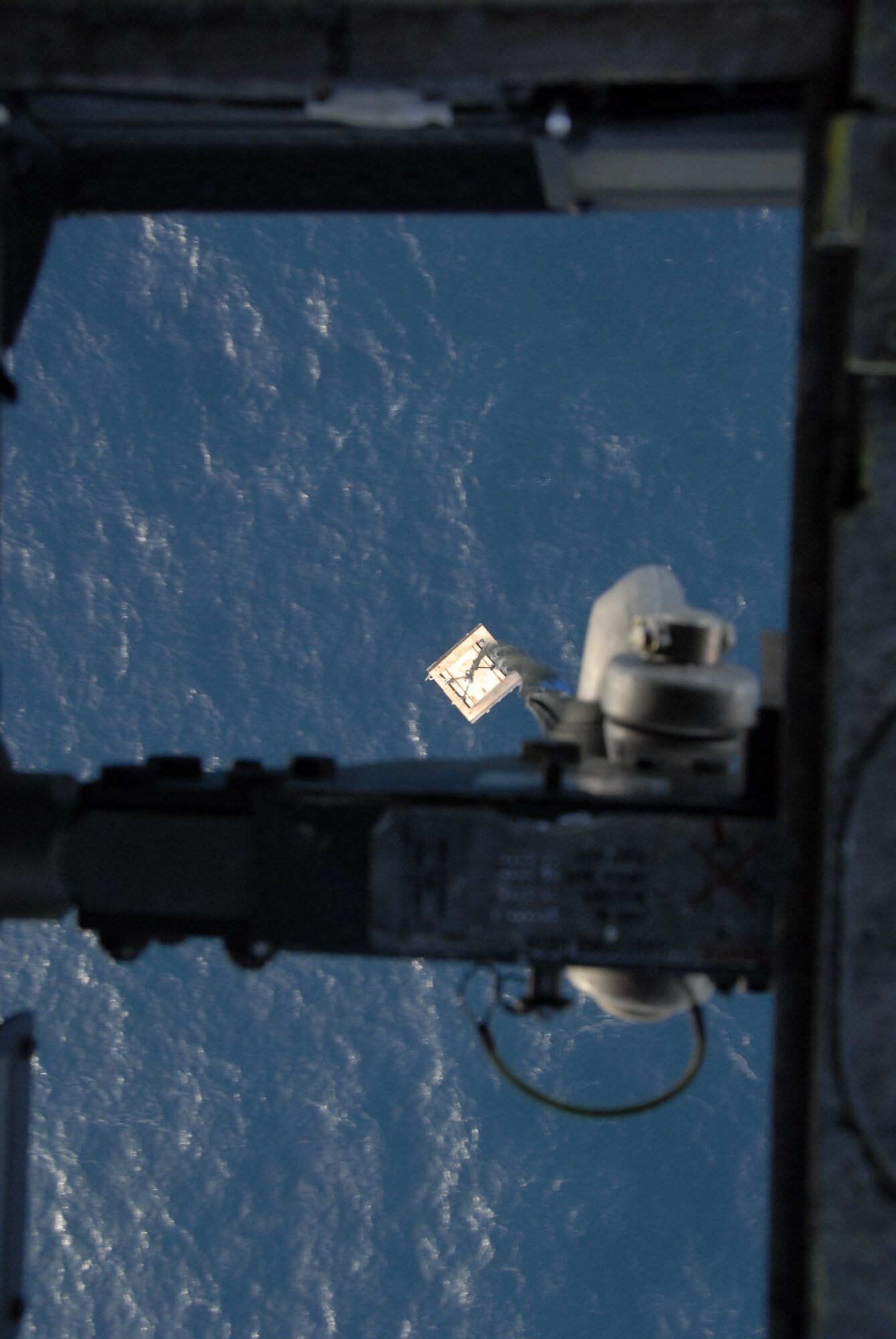 Sling-loaded cargo dangles from a 129th Rescue Wing, Moffett Federal Airfield-based HH-60G Pave Hawk flying over the Pacific Ocean. The unit supported the U.S. Fish and Wildlife Service by transporting 48 new photovoltaic batteries to power a lighthouse and workshop at the Fish and Wildlife Service research facility in the Farallon National Wildlife Refuge Feb. 17. (U.S. Air Force photo by Tech Sgt. Ray Aquino)(RELEASED)