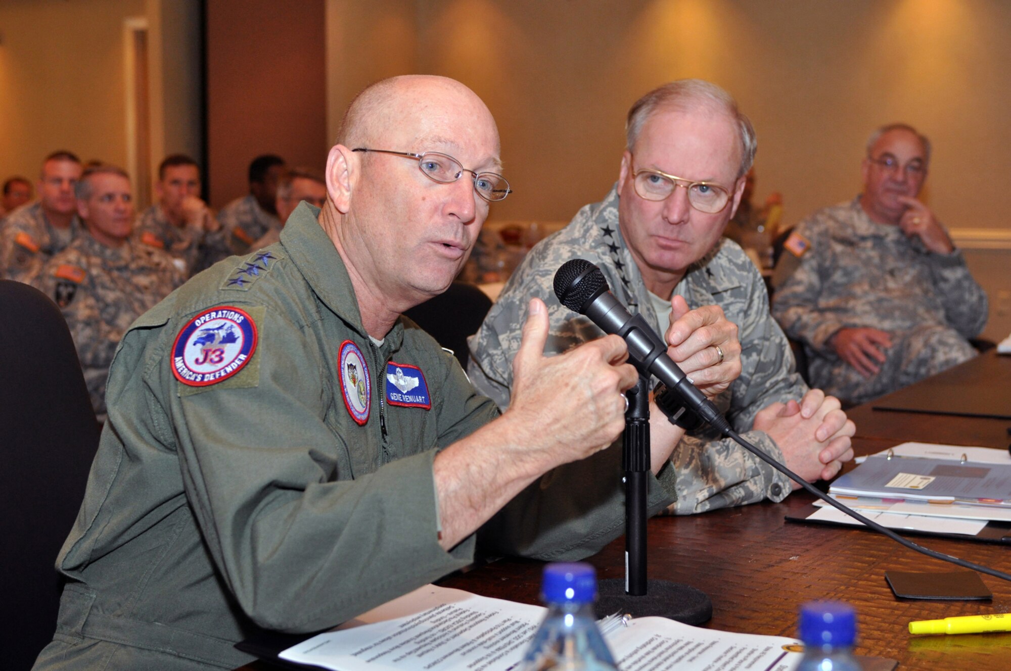 Gen. Gene Renuart, commander, U.S. Northern Command, and Gen. Craig McKinley, chief of the National Guard Bureau, discuss preparations for the 2009 hurricane season at a hurricane planning workshop sponsored by NGB and NORTHCOM at Hilton Head, S.C., on Feb. 19, 2009. A unified response is key to success after a storm, leaders say. (U.S. Army photo by Staff Sgt. Jim
Greenhill) (Released)