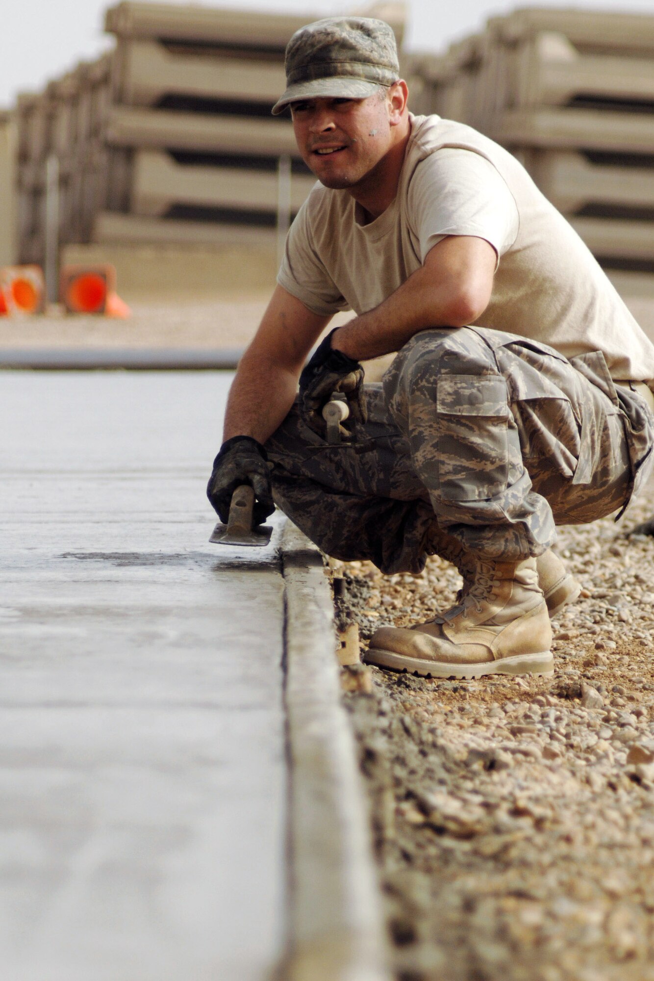 Staff Sgt. Ralph Keller takes a moment to observe his work Feb. 15 after helping lay a slab of concrete during a construction project at Joint Base Balad, Iraq. Sergeant Keller, a native of Pittsburgh, is a pavement and construction equipment operator with the 332nd Expeditionary Civil Engineer Squadron and is deployed from Hickam Air Force Base, Hawaii. (U.S. Air Force photo/Staff Sgt. Dilia Ayala) 