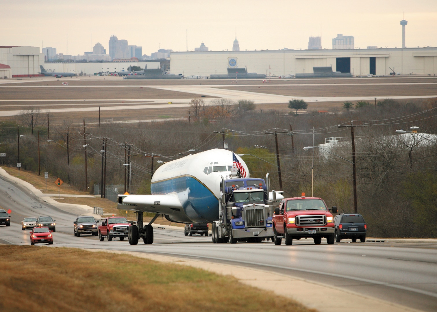 2/15/2009 - A Boeing KC-135 is towed along Military Drive Feb. 15. The aircraft, once part of Project Speckled Trout, arrived at Lackland in June 2008 and was converted into a trainer for aircrew members, including refueling boom operators, loadmasters, flight attendants and airborne missions systems specialists. (USAF photo by Robbin Cresswell)