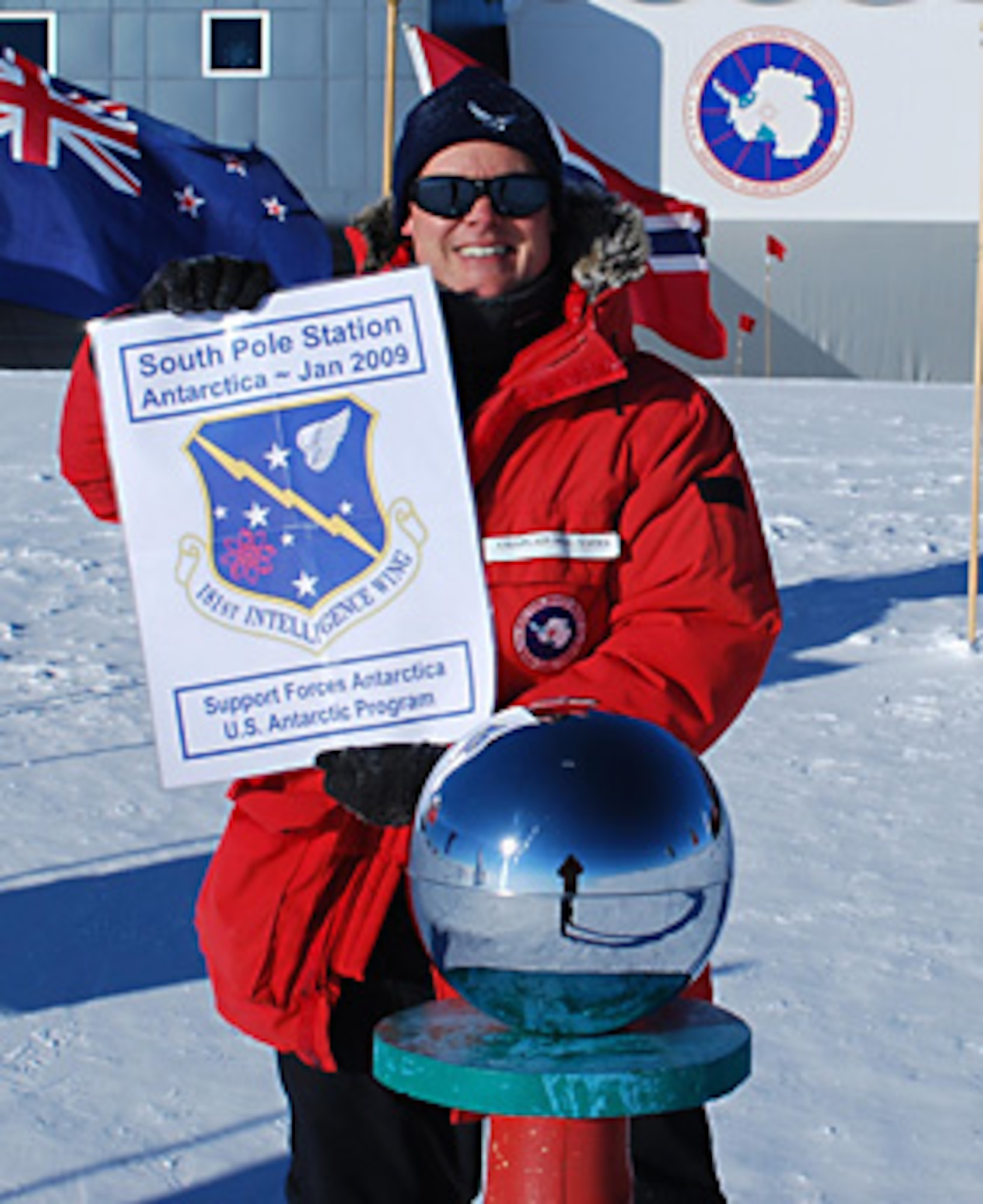 Lt. Col. William Yates proudly displays the 181st Intelligence Wing Patch at the South Pole.