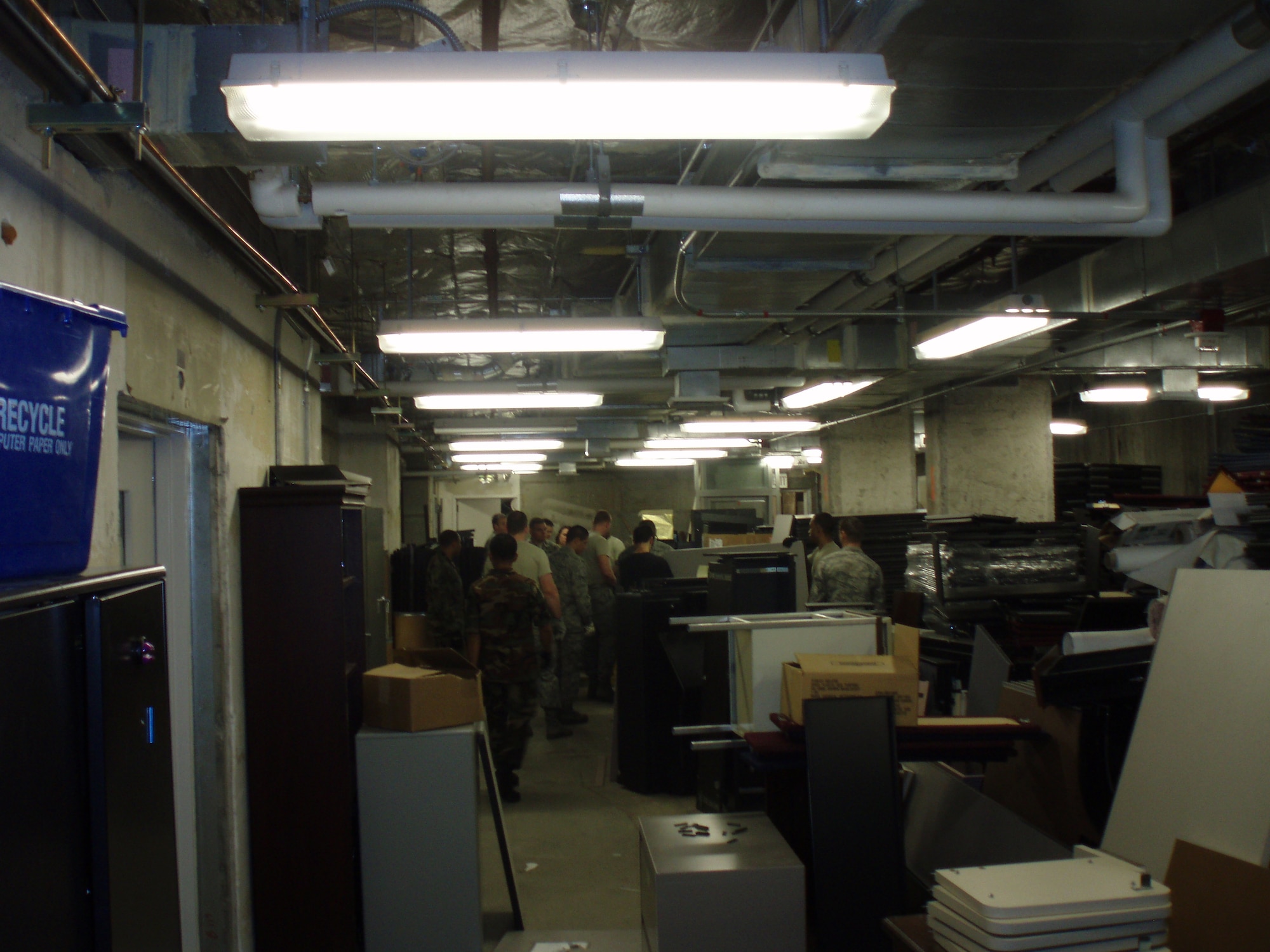 “The Cave,” a storage area in Bldg. 381 at Travis, is seen in January before a Six S project to clean the facility. More than 40 tons of materials were removed from the crowded space. (U.S. Air Force photo)