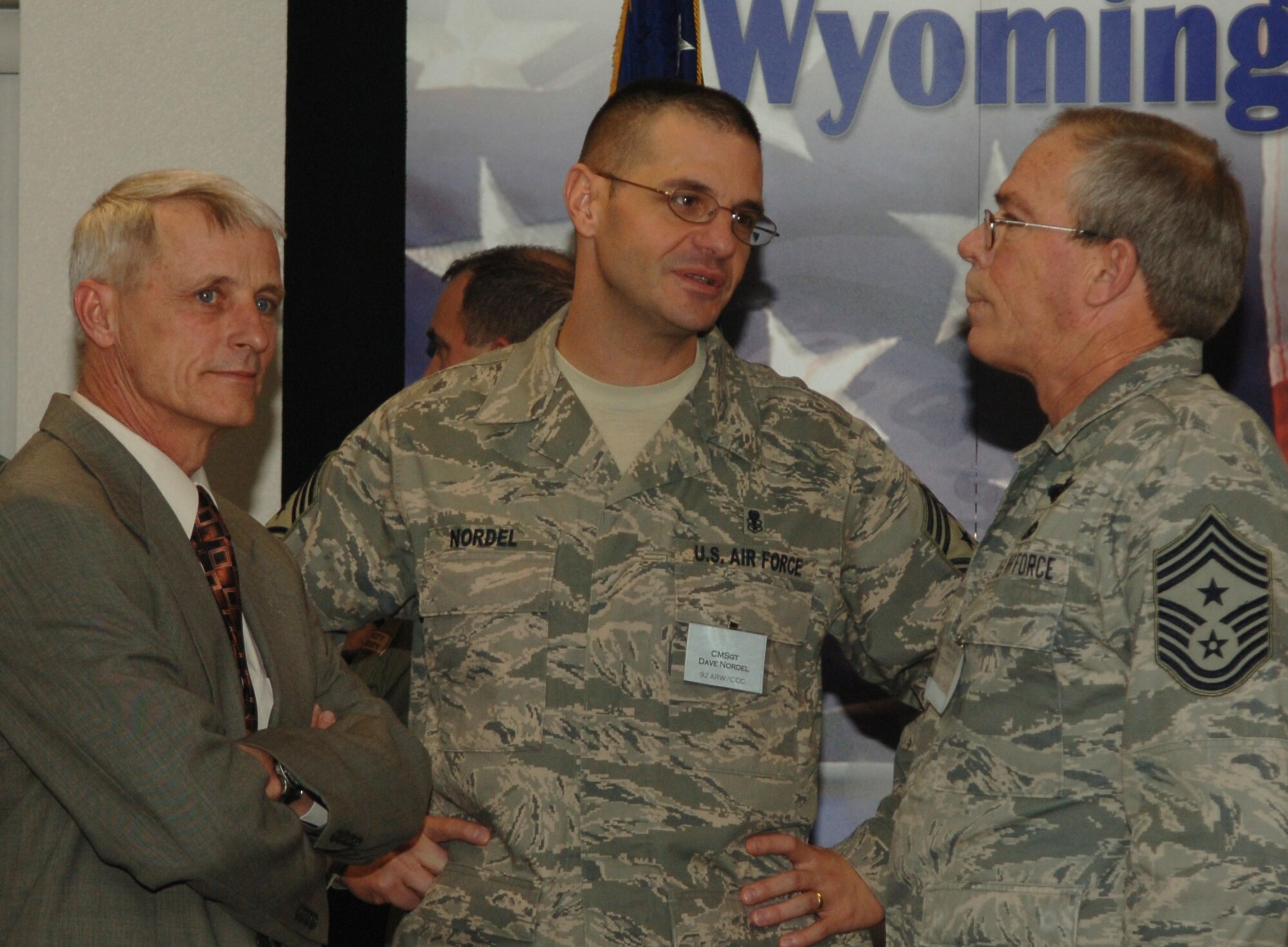 Chief Master Sgt. David Nordel, 92nd Air Refueling Wing command chief, speaks with Chief Master Sgt. Ralph “Doug” Hensala, Wyoming state command chief, and Chief Master Sgt. Thomas Loftin,153rd Airlift Wing command chief, Wyoming Air National Guard in Cheyenne, Wyo. Feb. 17. The visit to Wyoming was coordinated with hopes to see first-hand how another base has met and overcome some of the difficulties in Total Force Integration. (U.S. Air Force photo / Senior Airman Jocelyn A. Ford)