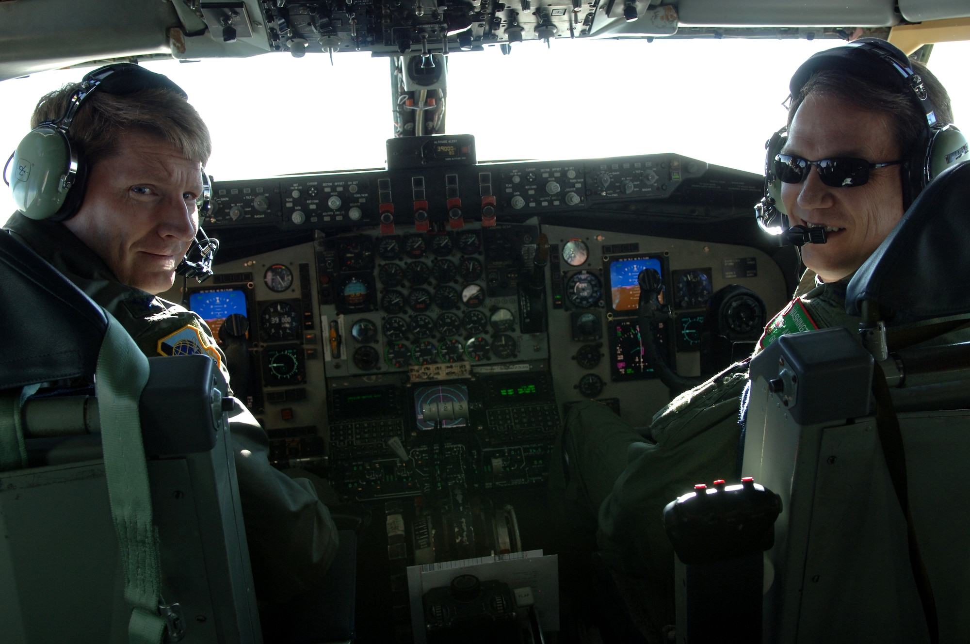 Col. Robert Thomas, 92nd Air Refueling Wing commander, and Col. Greg Bulkley, 141st Air Refueling Wing commander, take the pilot and co-pilot positions in the KC-135 during a flight to Cheyenne, Wyo. Feb. 17. Members of the 92nd and 141st flew together to visit the 153rd Airlift Wing, Wyoming Air National Guard because of their association with the 30th Airlift Squadron, in hopes to “garner any lessons learned about Total Force Integration,” said Maj. Paul Skipworth, Total Force Integration officer. (U.S. Air Force photo / Senior Airman Jocelyn A. Ford)
