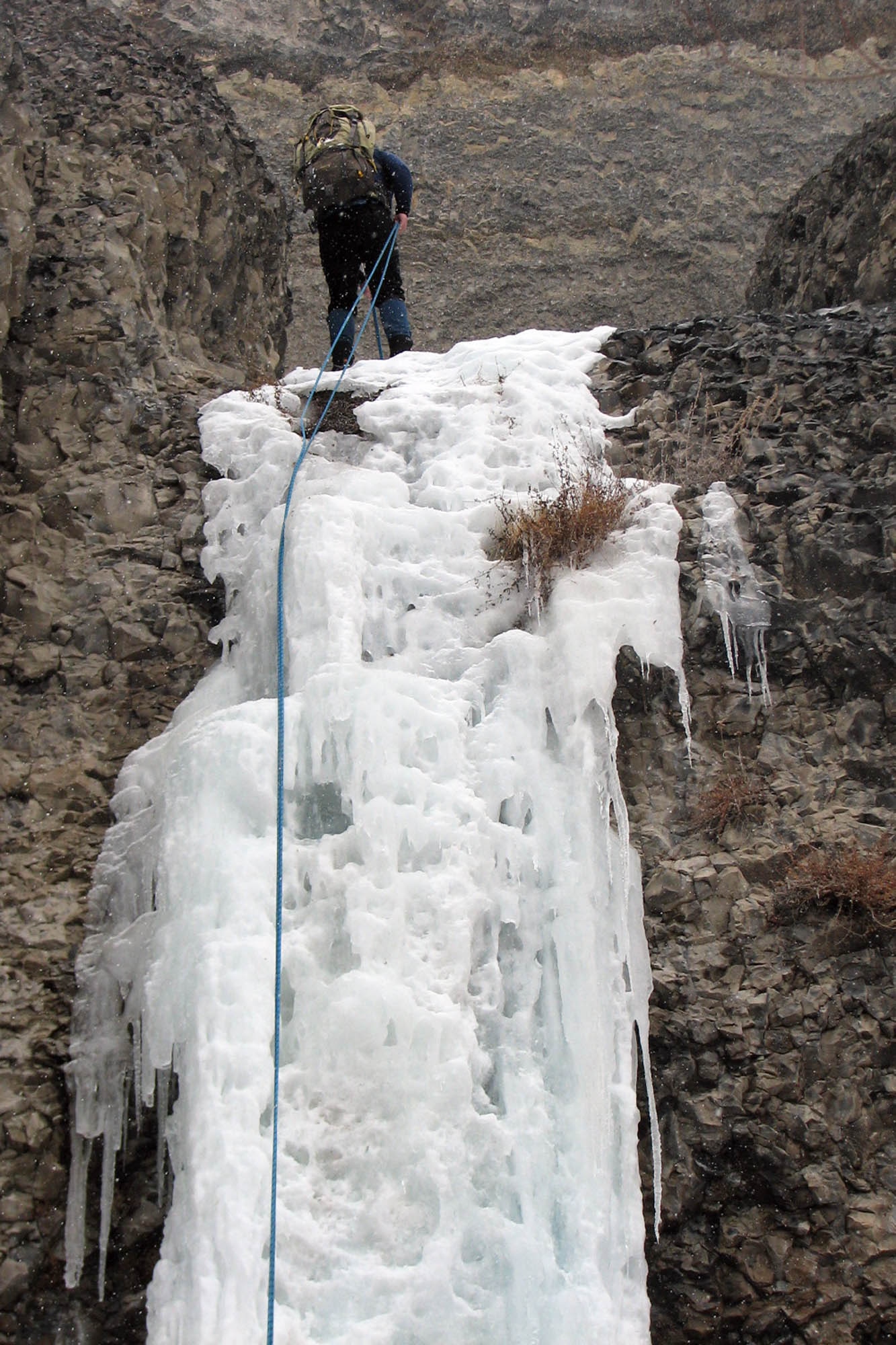 Ryan Murphy, Outdoor Recreation Connection staff member, descends a frozen waterfall during an ice climbing trip through the ORC Feb. 14. The ORC-coordinated trip provided eight people, including two ORC staff members, the opportunity to climb and descend a frozen waterfall in the Banks Lake Wildlife Recreation Area. (U.S. Air Force Photo / Senior Airman Kali L. Gradishar)