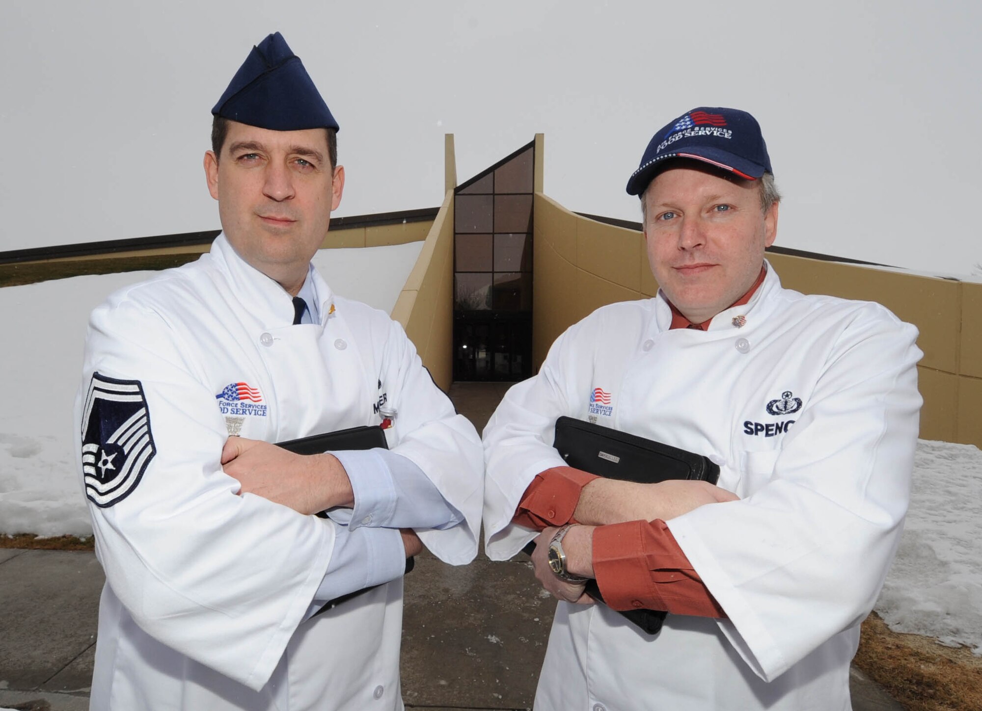 Senior Master Sgt. Troy Miller and Mr. Bill Spencer, Headquarters Air Force Services Agency Hennessey inspection team, San Antonio, Texas pose for a photo . (U.S. Air Force photo / Staff Sgt. JT May III)

