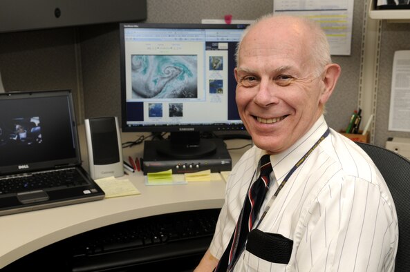 Lawrence Baker, head of AFRC command weather, explains the evolution of thunderstorm forecasting. Mr. Baker has served his country for a combined total of 50 years in both the U. S. Navy and the civil service. He will conclude his half-century of service by retiring March 2. U. S. air Force photo by Sue Sapp