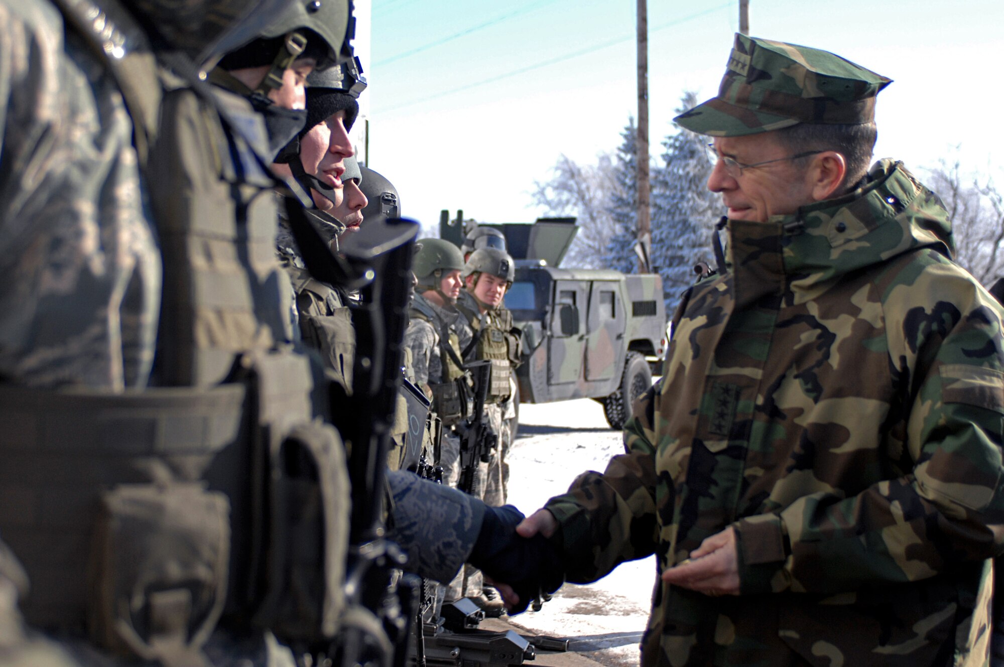 Adm. Michael G. Mullen, chairman of the Joint Chiefs of Staff, shakes hands with 91st Missile Wing security forces Airmen during a visit Feb. 18 to Minot Air Force Base, N.D.  He expressed his faith in the nuclear mission there and his appreciation of the hard work of the Airmen.  (U.S. Air Force photo/Senior Airman Kelly Timney)