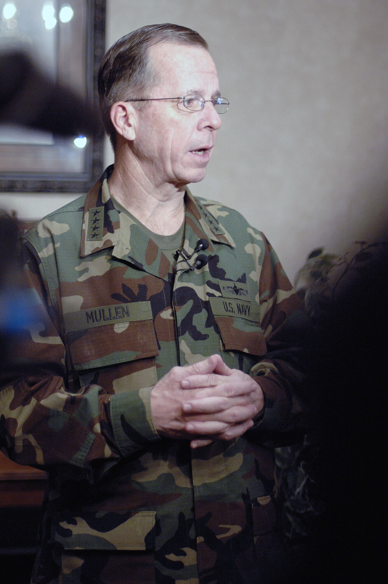 Adm. Michael G. Mullen, chairman of the Joint Chiefs of Staff, addresses local and national media during a visit Feb. 18 to Minot Air Force Base, N.D.  During his visit, Admiral Mullen held a town hall meeting and talked with Airmen about the importance of family support, concerns over the economic crisis and the base's role in nuclear deterrence as the Air Force's only dual-wing, nuclear-capable base.  (U.S. Air Force photo/Senior Airman Kelly Timney) 