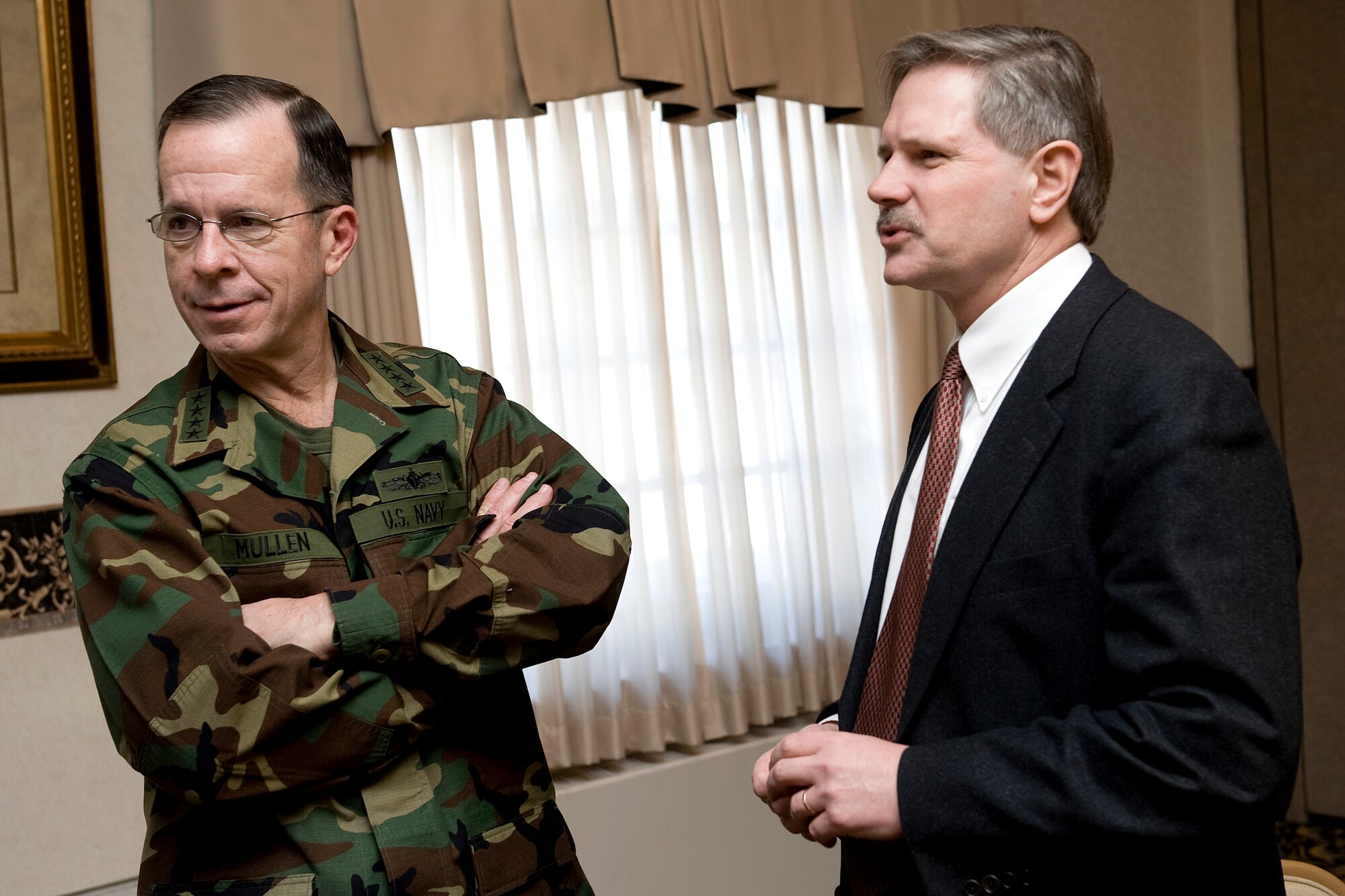 Adm. Michael G. Mullen, chairman of the Joint Chiefs of Staff, chats with North Dakota Governor John Hoeven Feb. 18 during a visit to Minot Air Force Base, N.D.  (Defense Department photo/Mass Communication Specialist 1st Class Chad J. McNeeley)