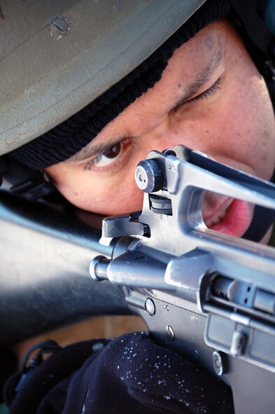 Capt. Rickardo Bodden, a student in the Advanced Contingency Skills Training Course, responds to a scenario during a training session in combat first aid on Feb. 5, 2009, on a Fort Dix, N.J., range.  ACST is taught by the U.S. Air Force Expeditionary Center's 421st Combat Training Squadron and prepares Airmen for upcoming deployments.  (U.S. Air Force Photo/Tech. Sgt. Scott T. Sturkol)