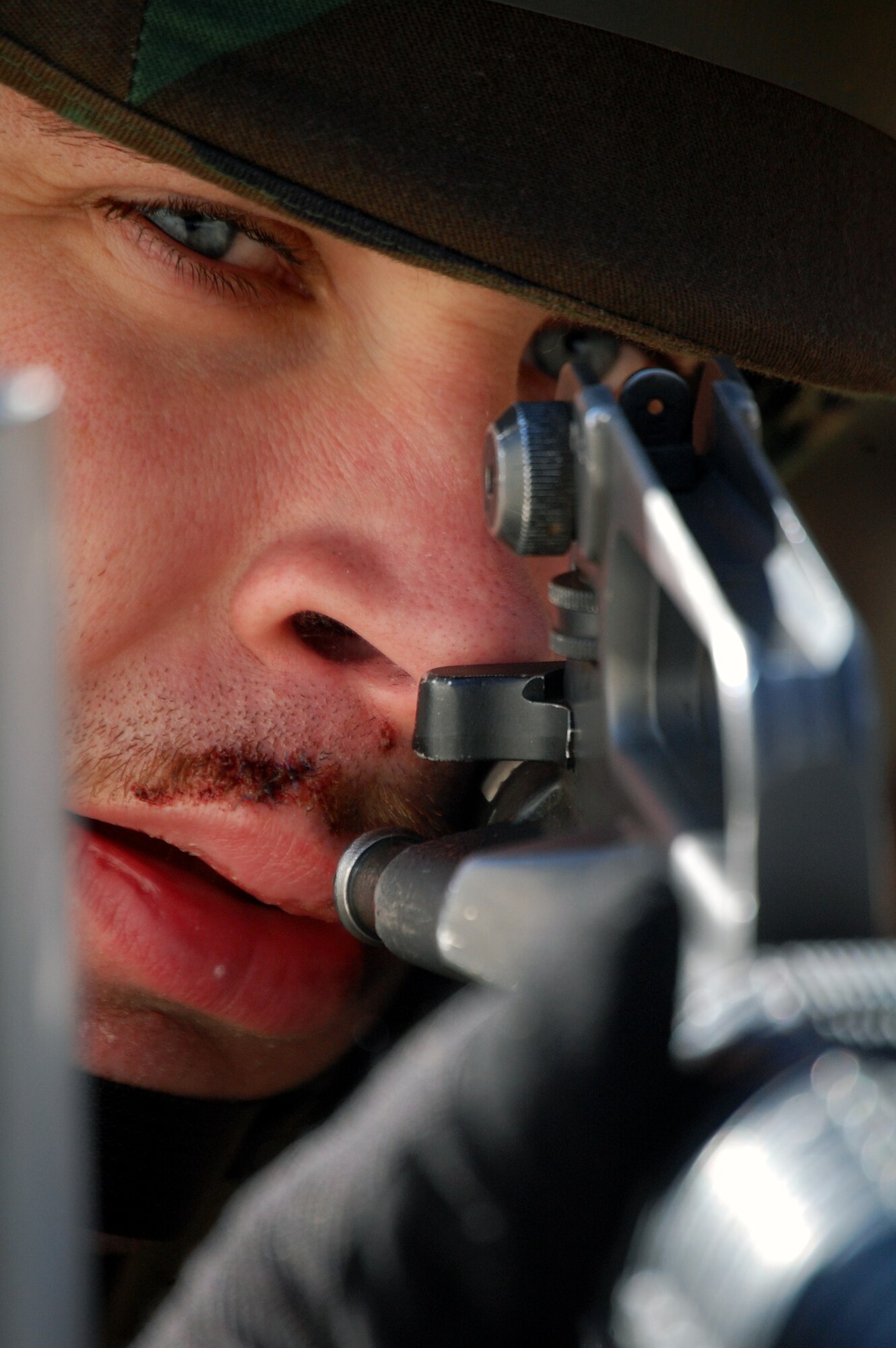 Staff Sgt. Bryan Hunt, a student in the Advanced Contingency Skills Training Course, responds to a scenario during a training session in combat first aid on Feb. 5, 2009, on a Fort Dix, N.J., range.  ACST is taught by the U.S. Air Force Expeditionary Center's 421st Combat Training Squadron and prepares Airmen for upcoming deployments.  (U.S. Air Force Photo/Tech. Sgt. Scott T. Sturkol)