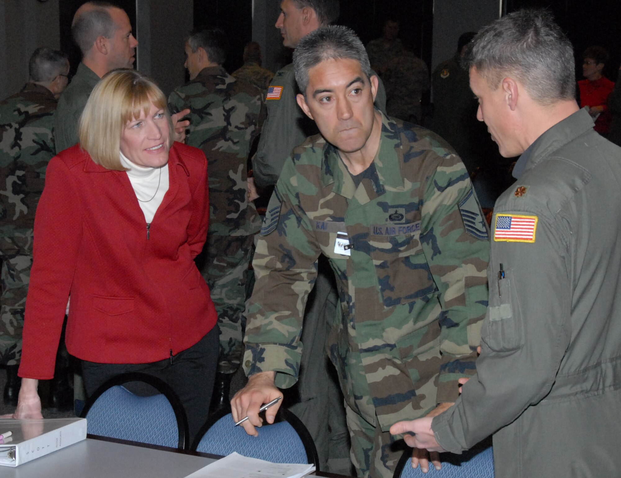 Bonnie Schemersahl, Air Mobility Command headquarters Tanker Manpower Analyst; Master Sgt. Bob Kai, HQ AMC Tanker Manpower Analyst; and Maj. Shawn Gahring, HQ AMC Current Operations and Tanker Policy; discuss tanker requirements during the Jan. 26-30 Site Activation Task Force visit to Scott.. (U.S. Air Force photo/Staff Sgt. John Orrell) 