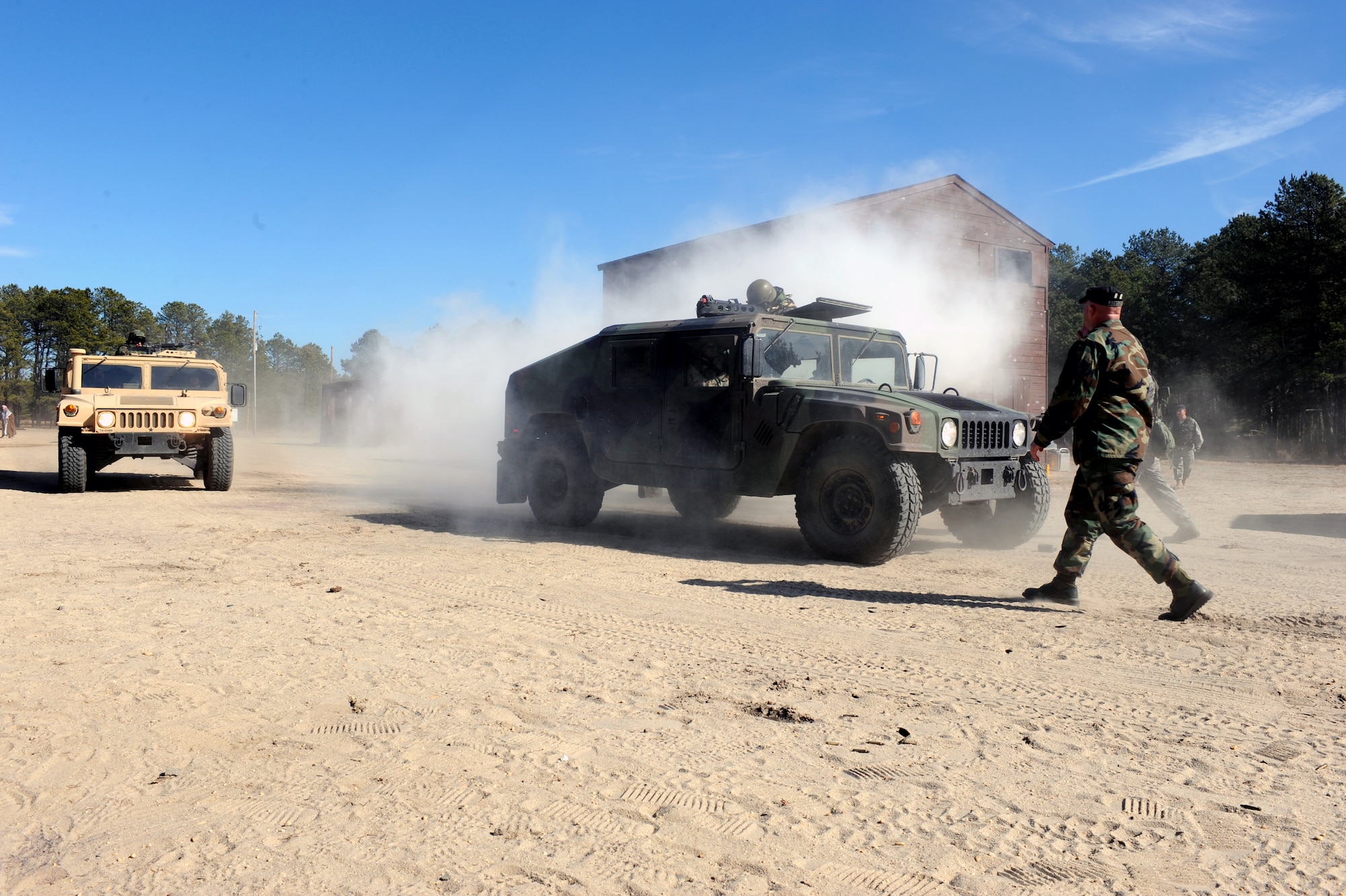 Students in the Air Force Advanced Contingency Skills Training Course, reacts to a scenario during convoy operations training on Feb. 17, 2009, at a range on Fort Dix, N.J.  The course is taught by the U.S. Air Force Expeditionary Center's 421st Combat Training Squadron, also at Fort Dix.  The course prepares Airmen for upcoming deployments through training in everything from convoy operations and combat first aid to patrolling and tactics.  (U.S. Air Force Photo/Staff Sgt. Nathan Bevier)