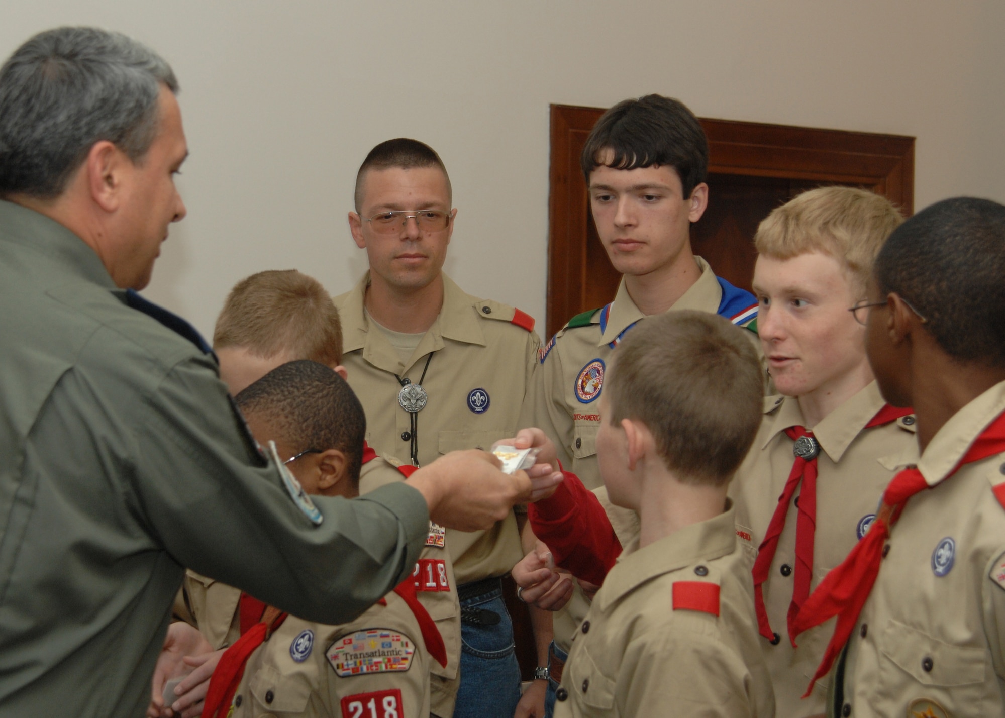 Gen. Haluk Selvi, 10th Tanker Base commander, presents Eric Price with a pin. Boy Scout Troop 218 visited the Turkish Air Force general to present him with a certificate of recognition to thank him for his support towards the Boy Scout Troop. (U.S. Air Force photo by Senior Airman Lauren Padden 39th Air Base Wing public affairs) 