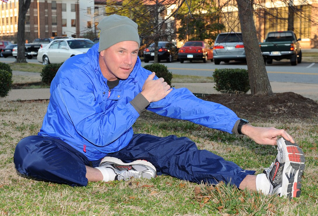 LANGLEY AIR FORCE BASE, Va. – Maj. Randolph Langer, Manpower requirement branch chief for Air Combat Command stretches before the Valentines day 10K run here Feb 13. The 1st  Force Support squadron hosted a 10K to boost morale for the volunteers.(U.S. Air Force photo/Airman 1st Class Gul Crockett) 
