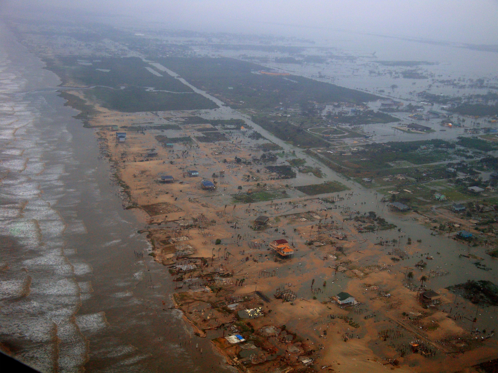 GALVESTON, Texas -- The Galveston coastline lies in ruin roughly 14 hours after Hurricane Ike made landfall, with only a few, lucky houses still standing. Deployed to the Gulf region days before the deadly hurricane struck, 920th Rescue Wing reservists took part in the relief effort and saved 17 lives in the small Texas town of Nederland. (U.S. Air Force photo/Capt. Steve Sartain) 