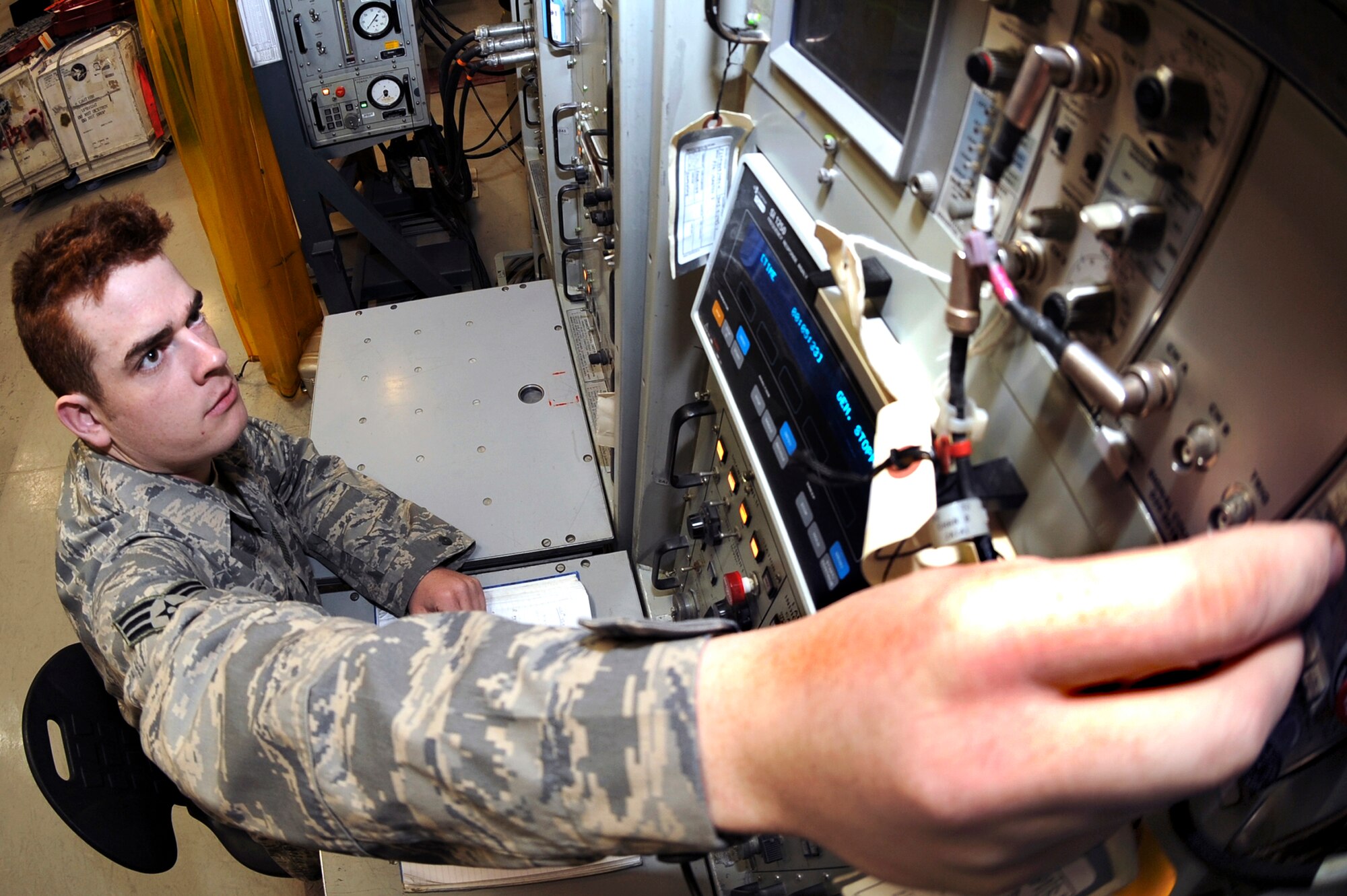 Senior Airman Josh Simmons, the Avionics Intermediate Section Radar Team Leader for the 379th Expeditionary Maintenance Squadron, adjusts the image on an oscilloscope at a radar test station, Feb. 19, 2009, in an undisclosed location in Southwest Asia.  The test station ensures F-15E Strike Eagle radars are working properly and are mission ready.  Airman Simmons is native to Christiansburg Va., and is deployed from Royal Air Force, Lakenheath, England in support of Operations Iraqi and Enduring Freedom and Combined Joint Task Force - Horn of Africa.  (U.S. Air Force Photo by Staff Sgt. Joshua Garcia/released)