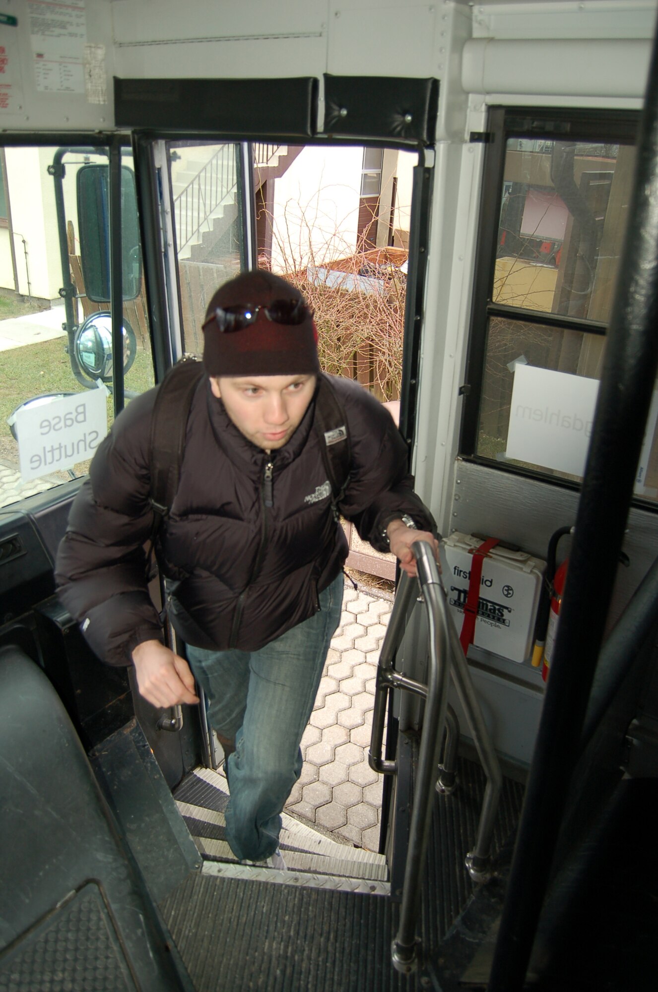 SPANGDAHLEM AIR BASE, Germany – Senior Airman Dustin Troutman, 52nd Aircraft Maintenance Squadron, uses the base shuttle for transportation to work after shipping his car for an upcoming permanent change of assignment move.  The Spangdahlem shuttle stops at more than 15 locations on the base.  (U.S. Air Force photo by Airman 1st Class Staci Miller)
