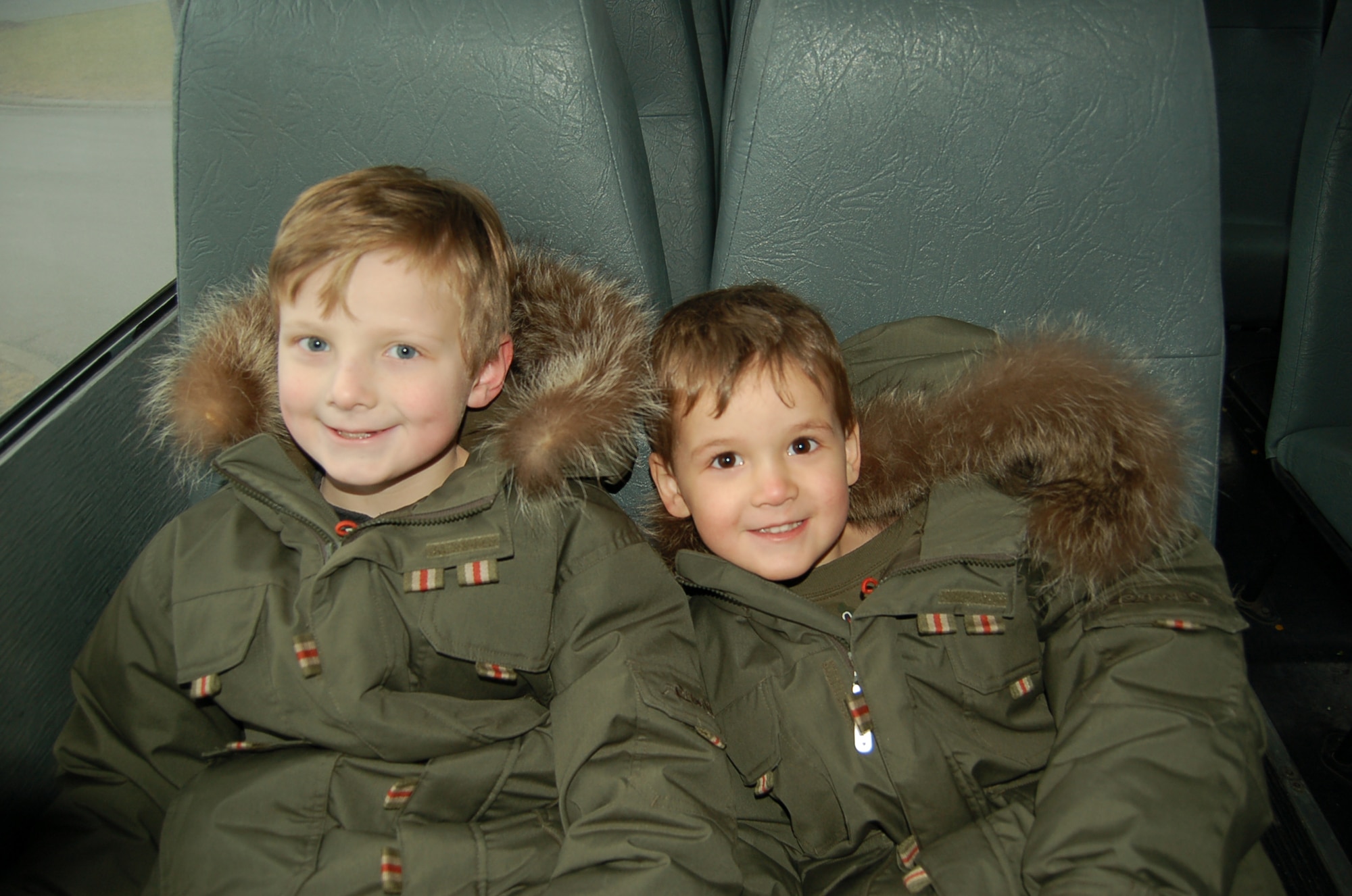 SPANGDAHLEM AIR BASE, Germany – (Left to right) Aiden and Cade Shattuck, sons of Staff Sgt. Jared Shattuck, 52nd Component Maintenance Squadron, enjoy a ride on the base shuttle base. The shuttle bus runs throughout the base weekdays 5:27 a.m. to 10:49 p.m. (U.S. Air Force photo by Staff Sgt. Tammie Moore)