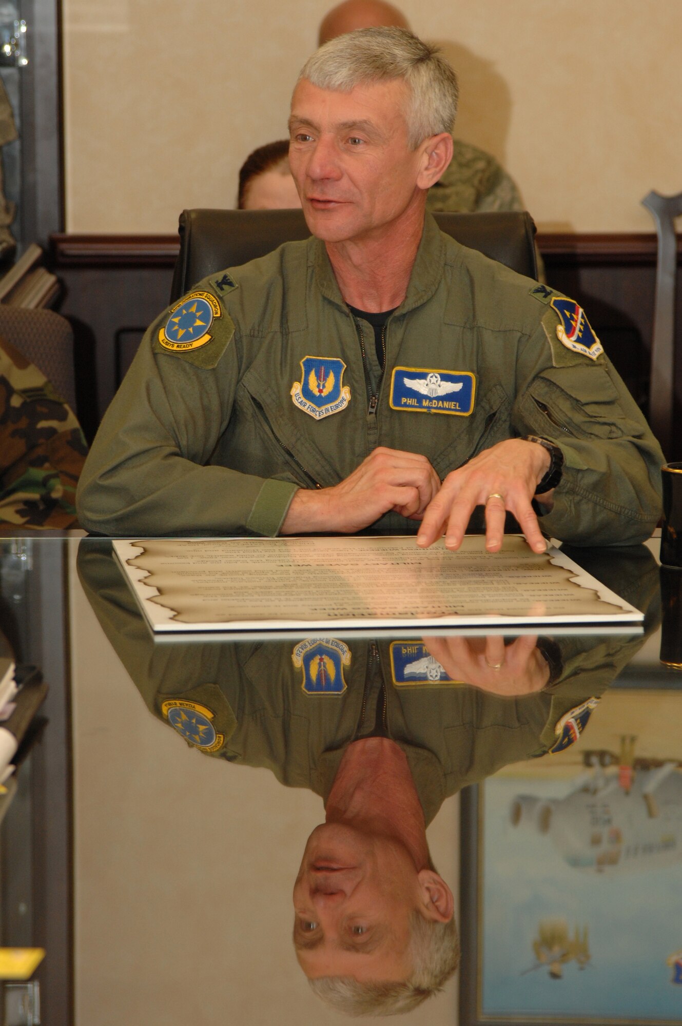 Col. Philip McDaniel, 39th Air Base Wing commander, signs the Military Saves Week Proclamation at a wing staff meeting Feb. 17. The signing of the proclamation is in preparation for Military Saves Week Feb. 22- March 1. The week is dedicated to informing the entire base on saving money, reducing debt and building wealth. (U.S. Air Force photo by Senior Airman Lauren Padden)
