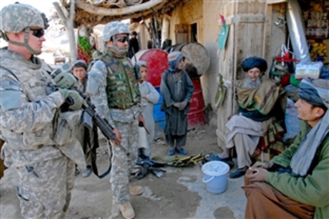 U.S. Army 1st Lt. Larry Baca meets with Afghan shop owners in a town near Forward Operating Base Lane, Afghanistan, Feb. 17, 2009. Baca is assigned to Company C, 1st Battalion, 4th Infantry Regiment.