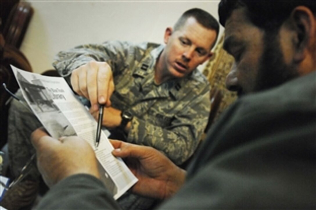 U.S. Air Force Capt. James E. Parris meets with Dr. Nadir Noori, the  Paktia provincial public health director, to discuss medical needs within the Afghanistan province, Feb. 9, 2009. Parris is a physician’s assistant with the Paktia provincial reconstruction team charged with assessing the health care needs of the province, and recommending projects and purchases.