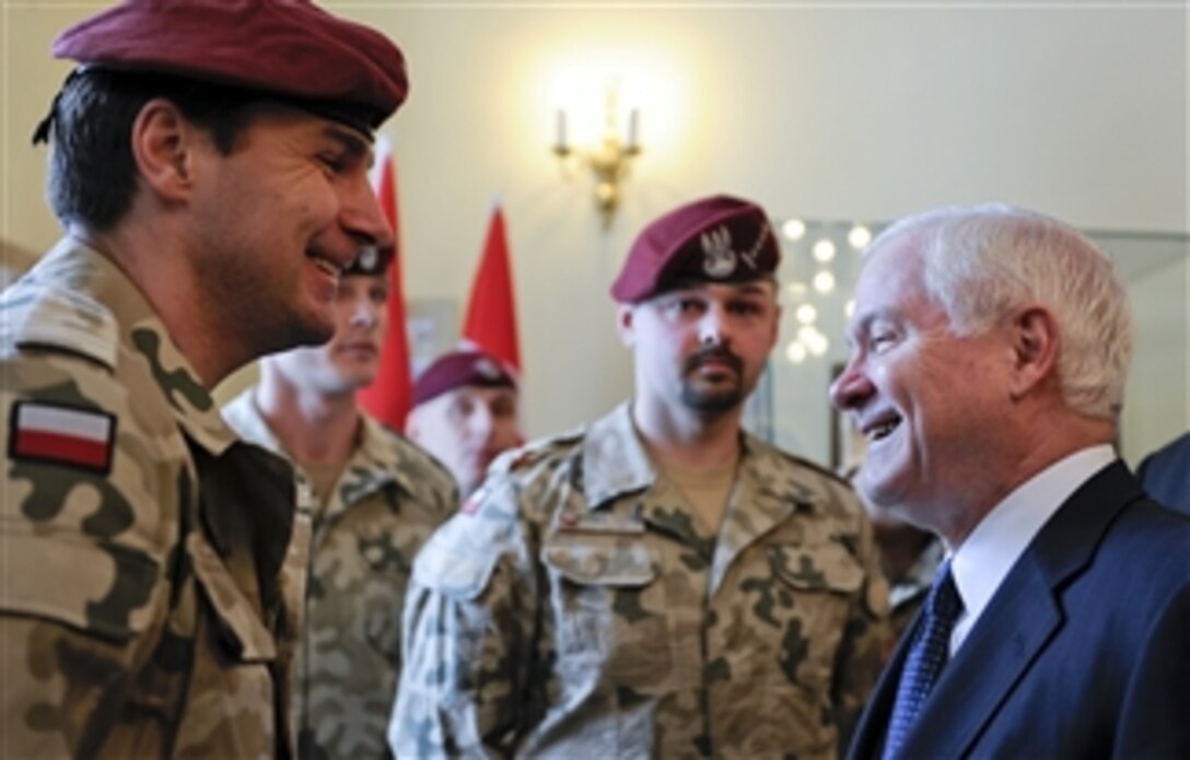 Secretary of Defense Robert M. Gates (right) meets with Polish Special Forces members in Krakow, Poland, on Feb. 19, 2009.  The Polish service members recently returned from Afghanistan.  Gates is in Poland to attend the Polish Defense Ministry Conference.  