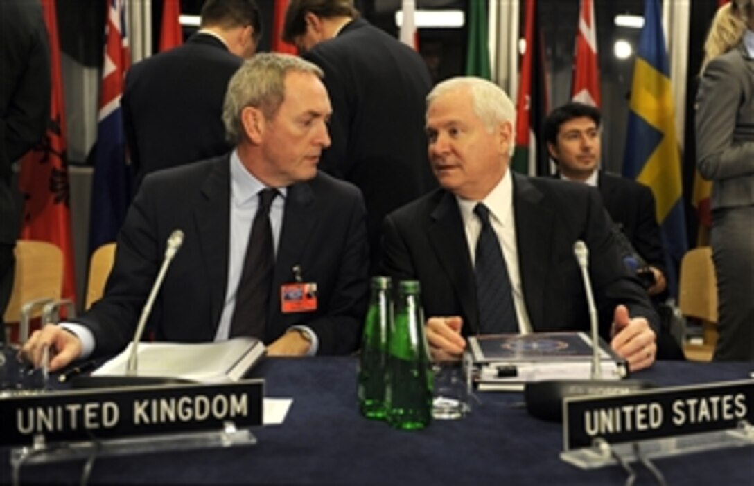 British Defense Secretary John Hutton and Secretary of Defense Robert M. Gates talk at the non-NATO International Security Assistance Force meeting in Krakow, Poland, on Feb. 19, 2009.  