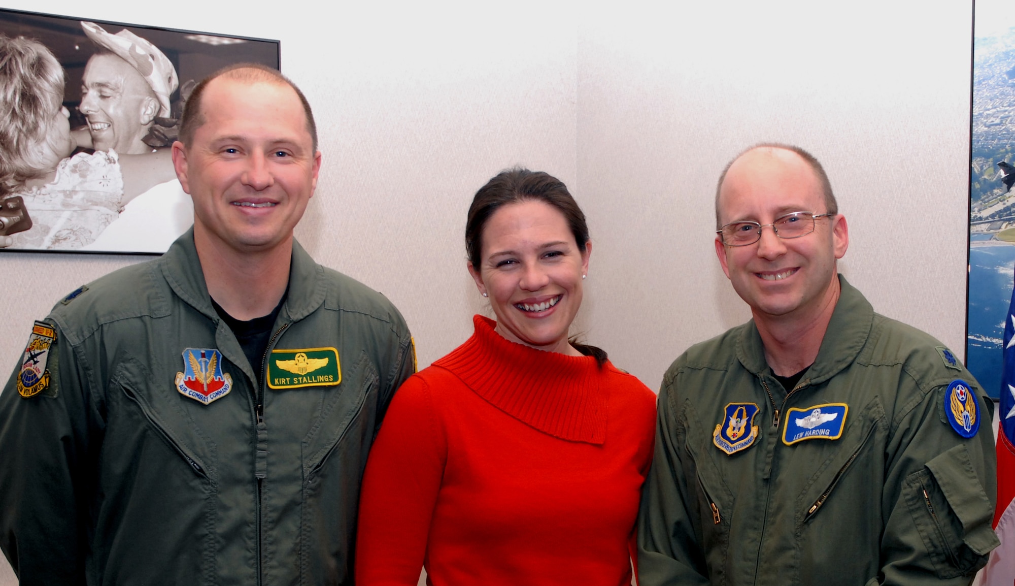 Stephanie Stallings, center, is all smiles after enlisting in the Reserve's 940th Air Refueling Wing, here. She is flanked by left, her husband, Lt. Col. Kirt Stallings, 9th Reconnaissance Wing director of staff, and right, Lt. Col. Lew Harding, 940th ARW chief of safety, who conducted her swearing in ceremony. (U.S. Air Force photo/SMSgt. Ellen L. Hatfield)