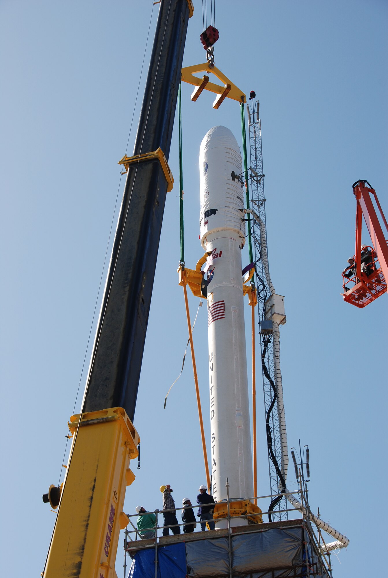 VANDENBERG AIR FORCE BASE, Calif. --  On Launch Complex 576-E here, the cables from the crane overhead are removed from NASA's Orbiting Carbon Observatory upper stack. OCO is scheduled for launch the Taurus rocket Feb. 24 from Vandenberg. The spacecraft will collect precise global measurements of carbon dioxide (CO2) in the Earth's atmosphere. (Photo courtesy of NASA)