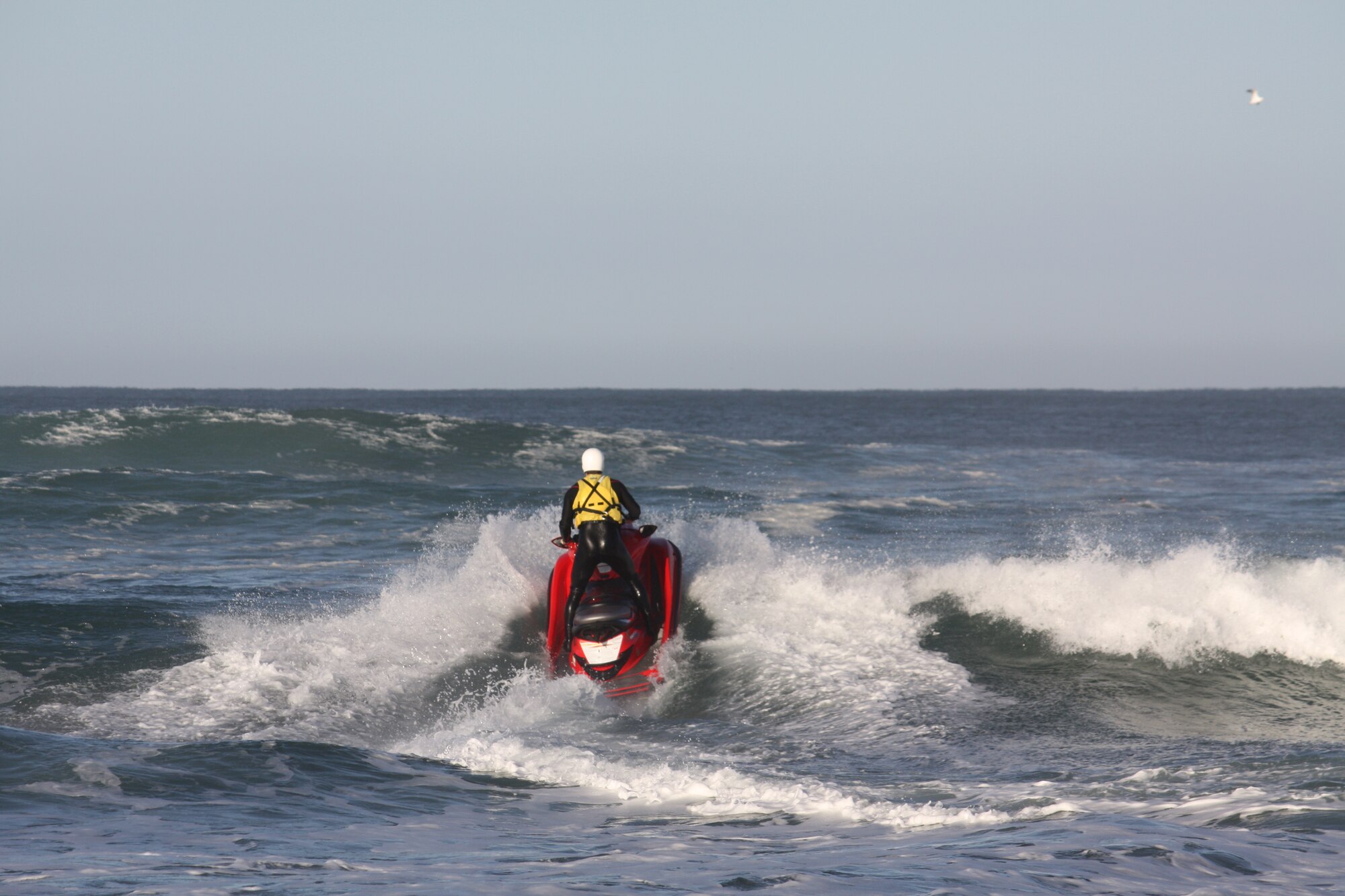 VANDENBERG AIR FORCE BASE, Calif. --  Vandenberg firefighter Matt Stevens races through the waves during a water rescue at Wall Beach here Feb. 19. The Vandenberg Fire Department's water rescue team rescued an Airman who was pulled out to sea while surfing. (Courtesy photo)