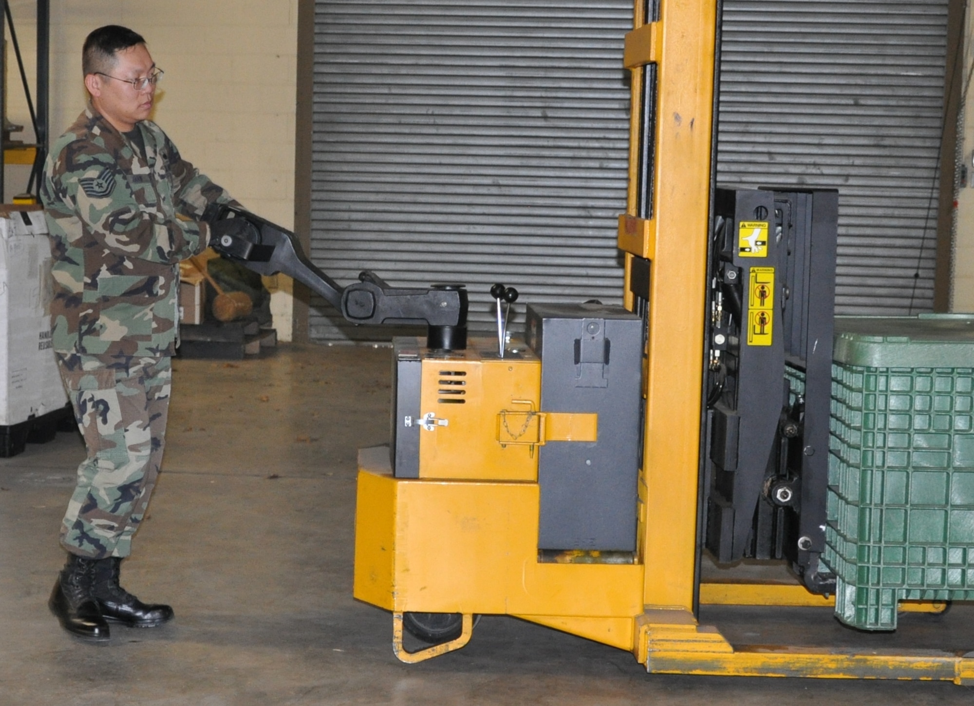 EGLIN AIR FORCE BASE, Fla. -- Tech. Sgt. Teddy Goon, 33rd Maintenance Operations Squadron mobility equipment element non-commissioned officer in charge, moves a pallet of supplies into a storage location at Eglin's Readiness Center Feb. 20. During his time on station here, Sergeant Goon volunteers his free time at the local Air Force Enlisted Village and was recently awarded for his service to residents there. (U.S. Air Force Photo/Chrissy Cuttita)