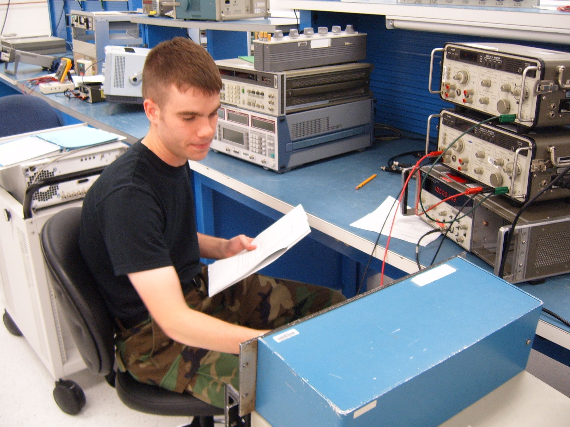 Senior Airman Anthony Ross, 60th Maintenance Group Precision Measurement Equipment Laboratory technician, calibrates a Transmission Test Set, used to test communication lines on base. PMEL test measurement and diagnostics equipment for more than 208 work centers at Travis, across California and other bases across the country. (U.S. Air Force photo/Master Sgt. Lisa Winders)