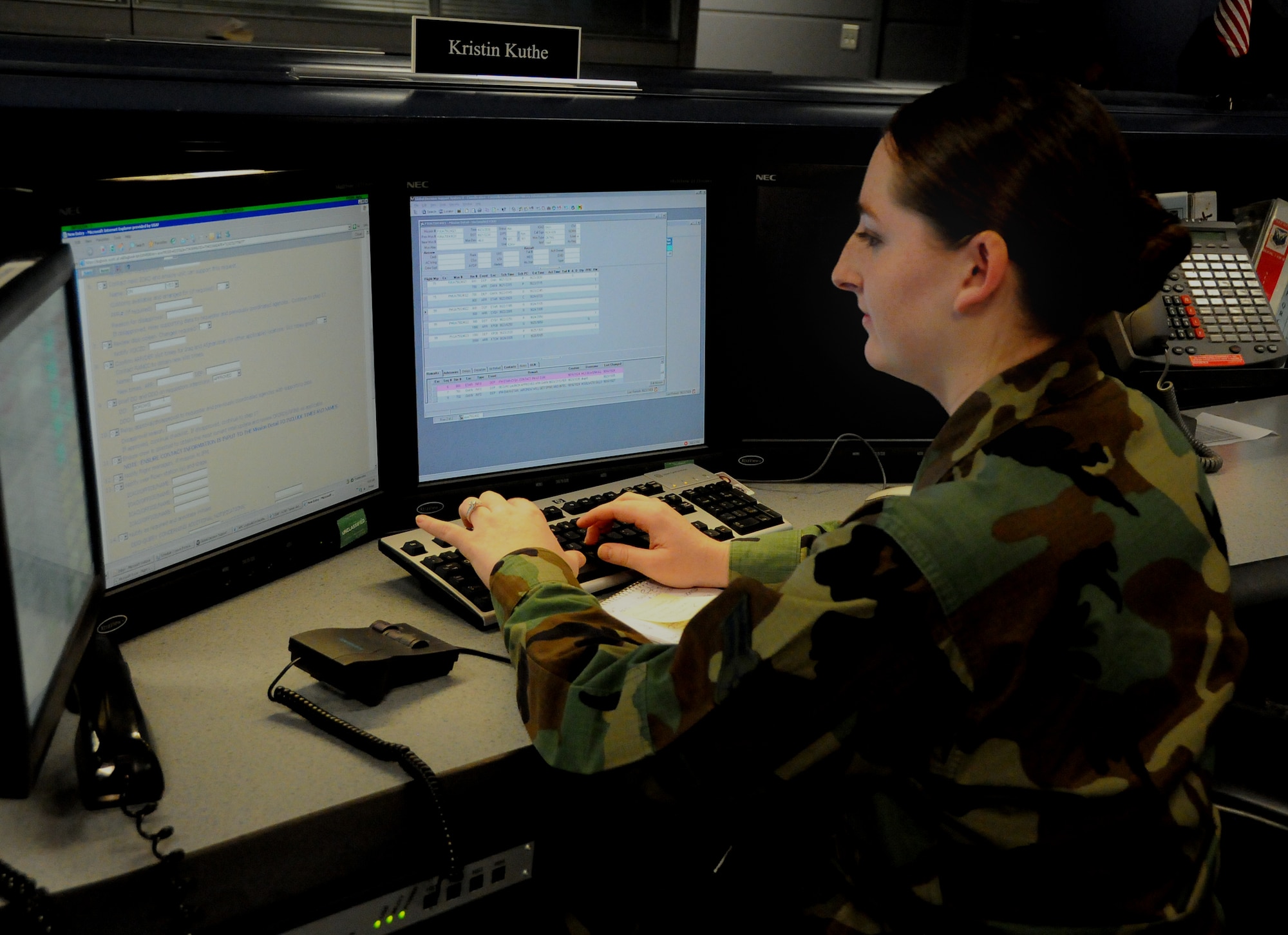 SCOTT AIR FORCE BASE, Ill. -- Airman 1st Class Kristin Kuthe, a Command Post controller assigned to the 618th Tanker Airlift Control Center, assists an Air Mobility Command aircrew from the 618th TACC Operations Floor. 618th TACC Command Post controllers are available 24-hours-a-day and engage in a combined 37,000 phone calls each month to assist AMC aircrews worldwide. (Department of Defense photo/Mr. Robert Fehringer)