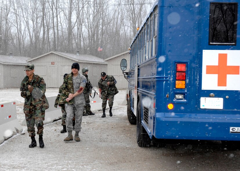 Airmen with simulated wounds arrive at the Warfighter Training Facility at Wright-Patterson Air Force Base during a readiness exercise held Feb. 17-20.  Over 150 Airmen deployed to the facility to enhance their wartime capabilities.  
