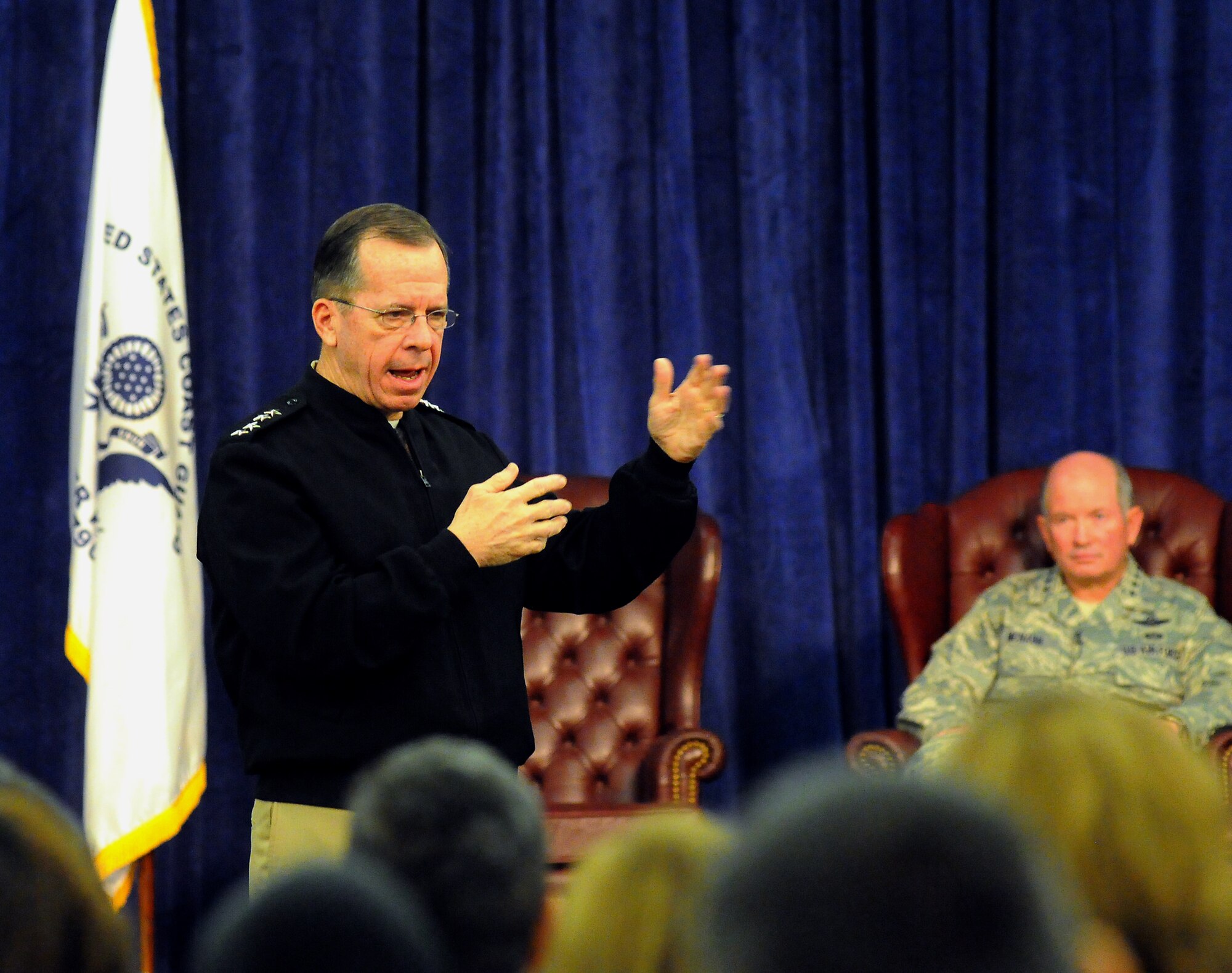 SCOTT AIR FORCE BASE, Ill. -- Chairman of the Joint Chiefs of Staff Adm. Mike Mullen, answers a question from an  audience member, Feb. 19, during a town hall style meeting in the Scott Club at Scott Air Force Base, Ill.  Mullen visited USTRANSCOM where he met with USTRANSCOM Commander Gen. Duncan J. McNabb, Military Airlift Command Commander Gen. Art Lichte and members of their commands. (Photo by Bob Fehringer)