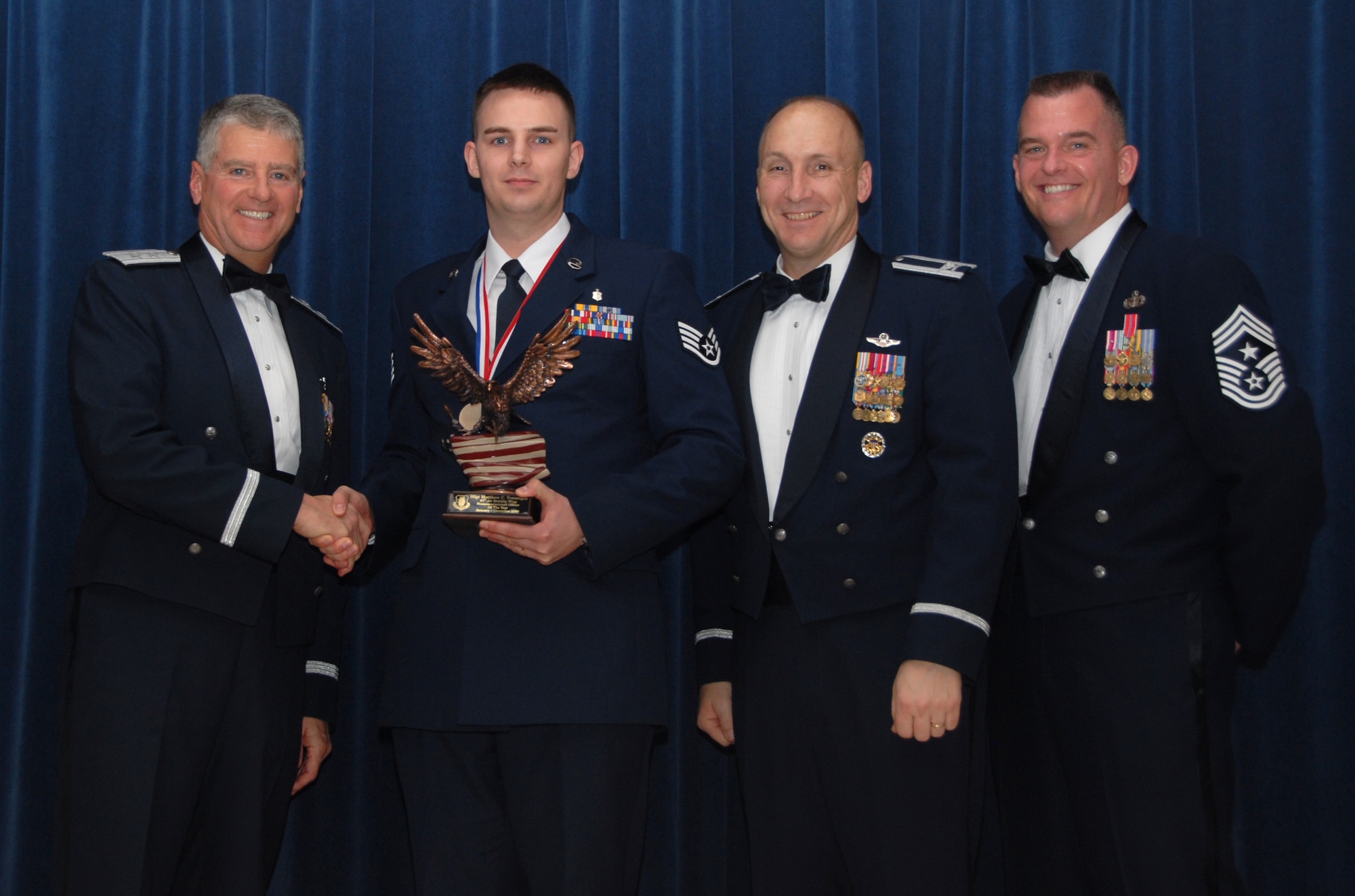ALTUS AIR FORCE BASE, Okla. -- Staff Sgt. Mathew Toenniges was recognized as the 97th Air Mobility Wing’s Non-commissioned Officer of the Year Feb. 13. The award was presented by Maj. Gen. Anthony Przybyslawski, Air Education and Training Command Vice Commander, 97th Air Mobility Wing Commander Col. David Allvin and Chief Master Sgt. Eric Malloy, 97th Air Mobility Wing Command Chief Master Sergeant.(U.S. Air Force photo/Airman 1st Class Cherice I. Bryant)