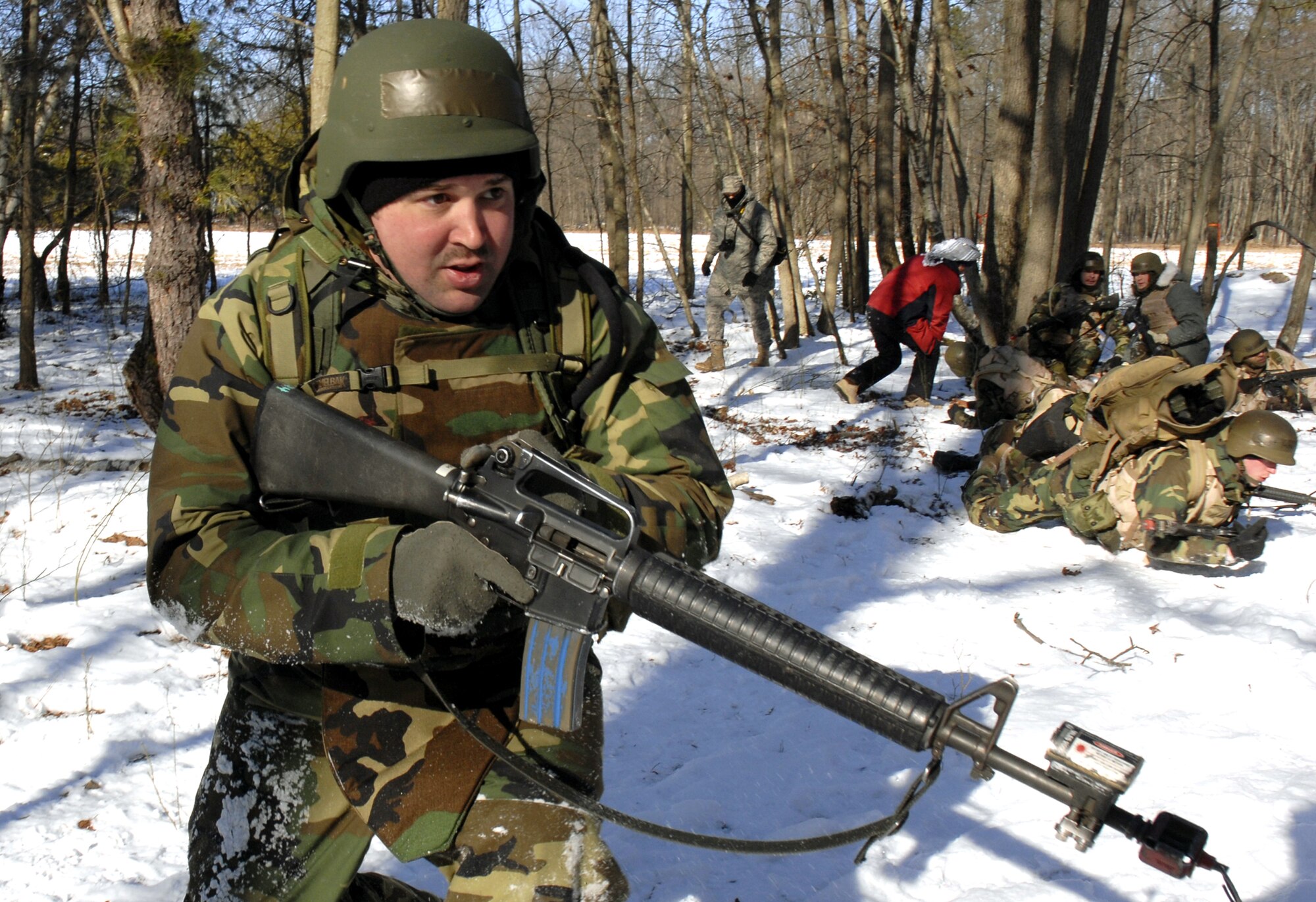 Students in the Advanced Contingency Skills Training Course 09-3 participate in a scenario for combat first aid on Feb. 5, 2009, on a Fort Dix, N.J., range.  The course, taught by the U.S. Air Force Expeditionary Center's 421st Combat Training Squadron, prepares Airmen for upcoming deployment providing combat skills training in everything from combat first aid and convoy operations to patrolling and tactics.  (U.S. Air Force Photo/Staff Sgt. Paul R. Evans)