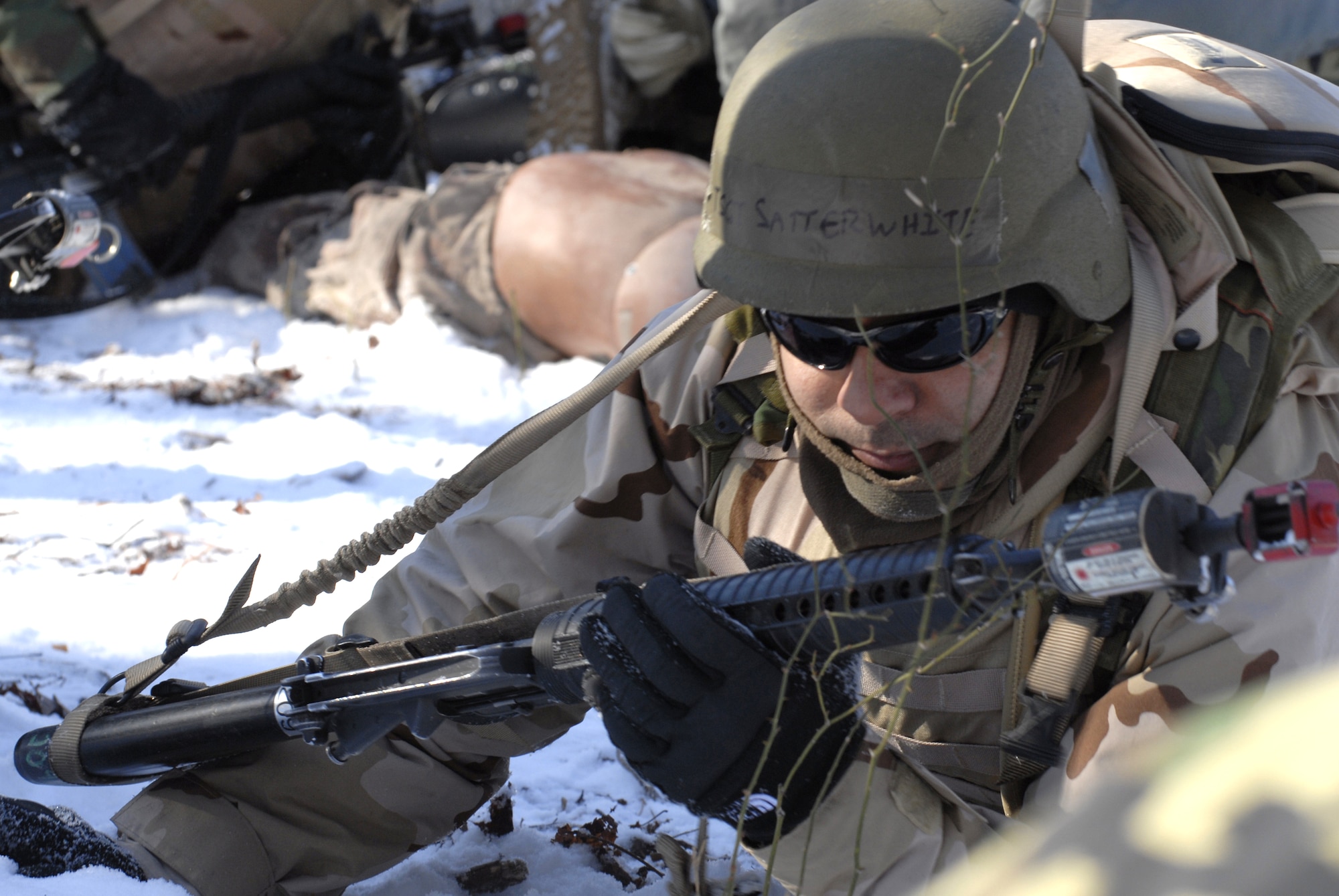 Students in the Advanced Contingency Skills Training Course 09-3 participate in a scenario for combat first aid on Feb. 5, 2009, on a Fort Dix, N.J., range.  The course, taught by the U.S. Air Force Expeditionary Center's 421st Combat Training Squadron, prepares Airmen for upcoming deployment providing combat skills training in everything from combat first aid and convoy operations to patrolling and tactics.  (U.S. Air Force Photo/Staff Sgt. Paul R. Evans)