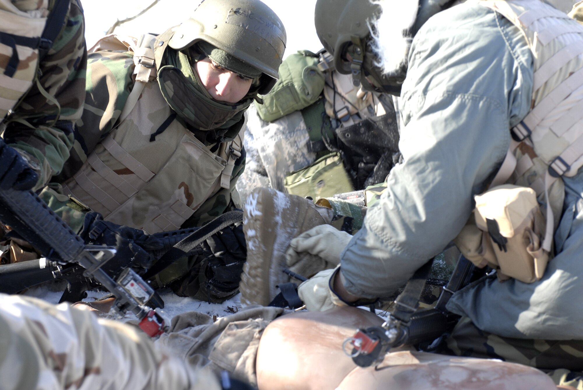 Students in the Advanced Contingency Skills Training Course 09-3 participate in a scenario for combat first aid on Feb. 5, 2009, on a Fort Dix, N.J., range.  The course, taught by the U.S. Air Force Expeditionary Center's 421st Combat Training Squadron, prepares Airmen for upcoming deployment providing combat skills training in everything from combat first aid and convoy operations to patrolling and tactics.  (U.S. Air Force Photo/Staff Sgt. Paul R. Evans)