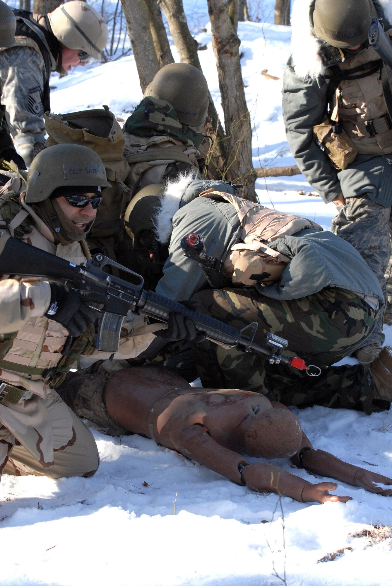 Students in the Advanced Contingency Skills Training Course 09-3 participate in a scenario for combat first aid on Feb. 5, 2009, on a Fort Dix, N.J., range.  The course, taught by the U.S. Air Force Expeditionary Center's 421st Combat Training Squadron, prepares Airmen for upcoming deployment providing combat skills training in everything from combat first aid and convoy operations to patrolling and tactics.  (U.S. Air Force Photo/Staff Sgt. Paul R. Evans)